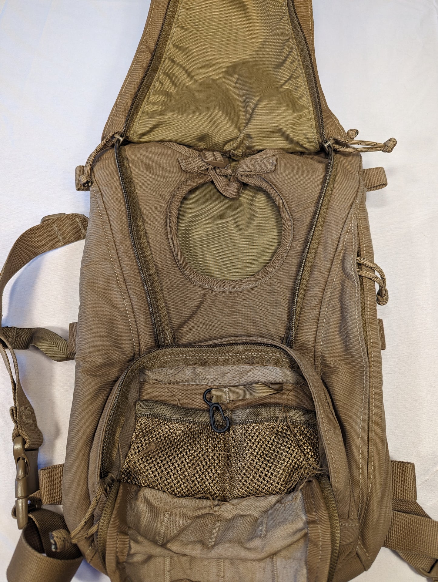 Brown tactical backpack on a white background