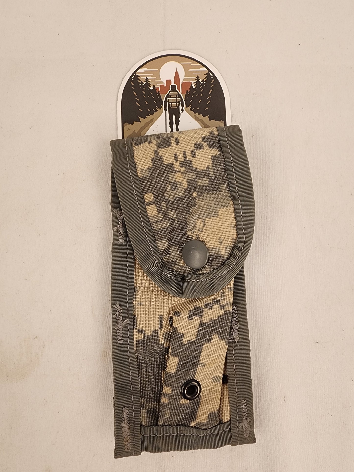 Genuine U.S. military surplus 9mm magazine pouch in UCP/ACU camouflage pattern.