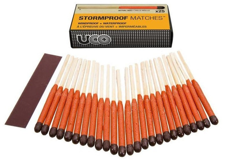 A pack of Stormproof Matches by Exotac with the box open displaying multiple matches with orange and brown tips, along with an extra striker.