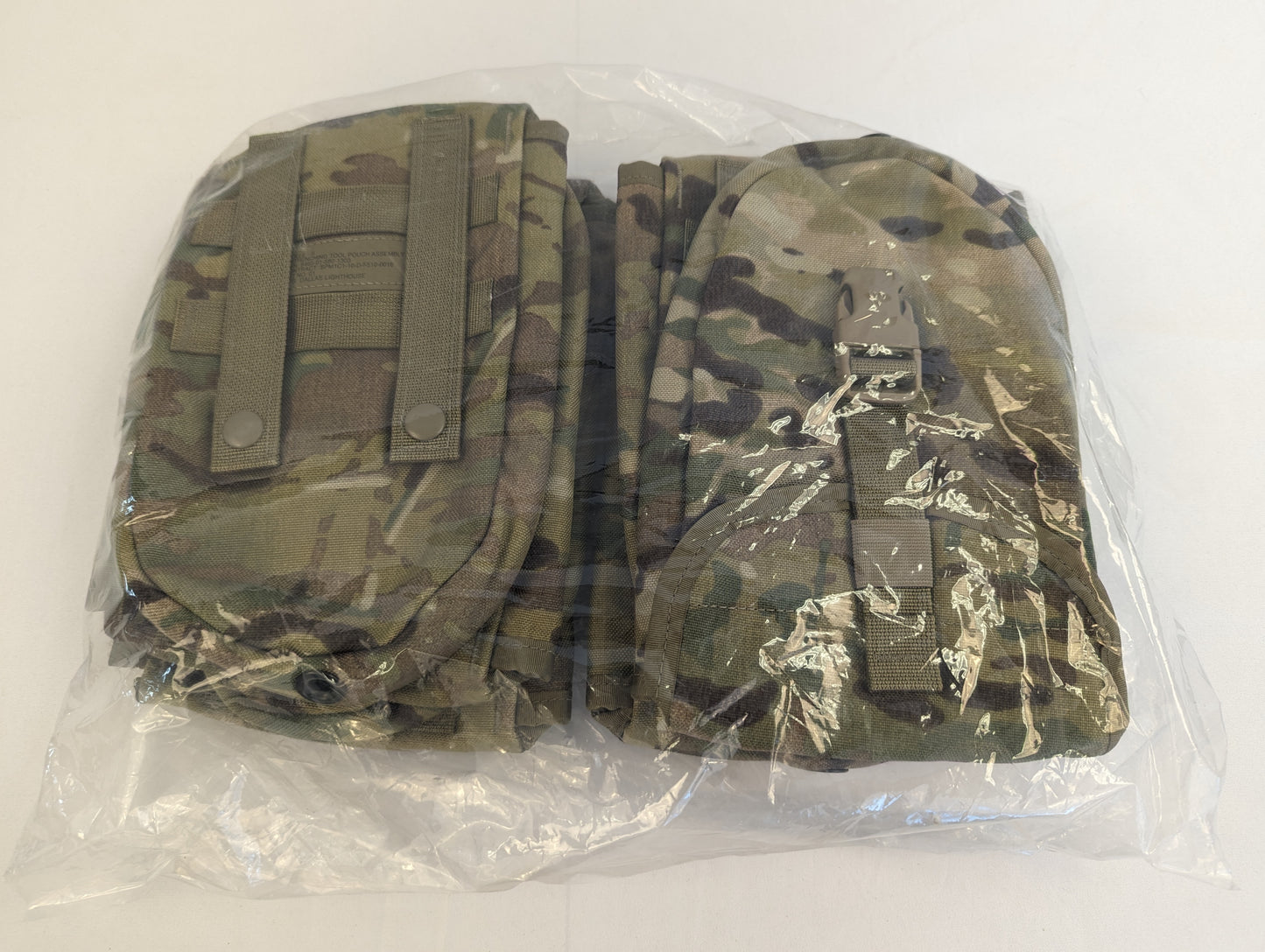 A bundle of four new U.S. Military Surplus Entrenching Tool Carrier pouches in OCP/Multicam camouflage, sealed inside clear plastic packaging.