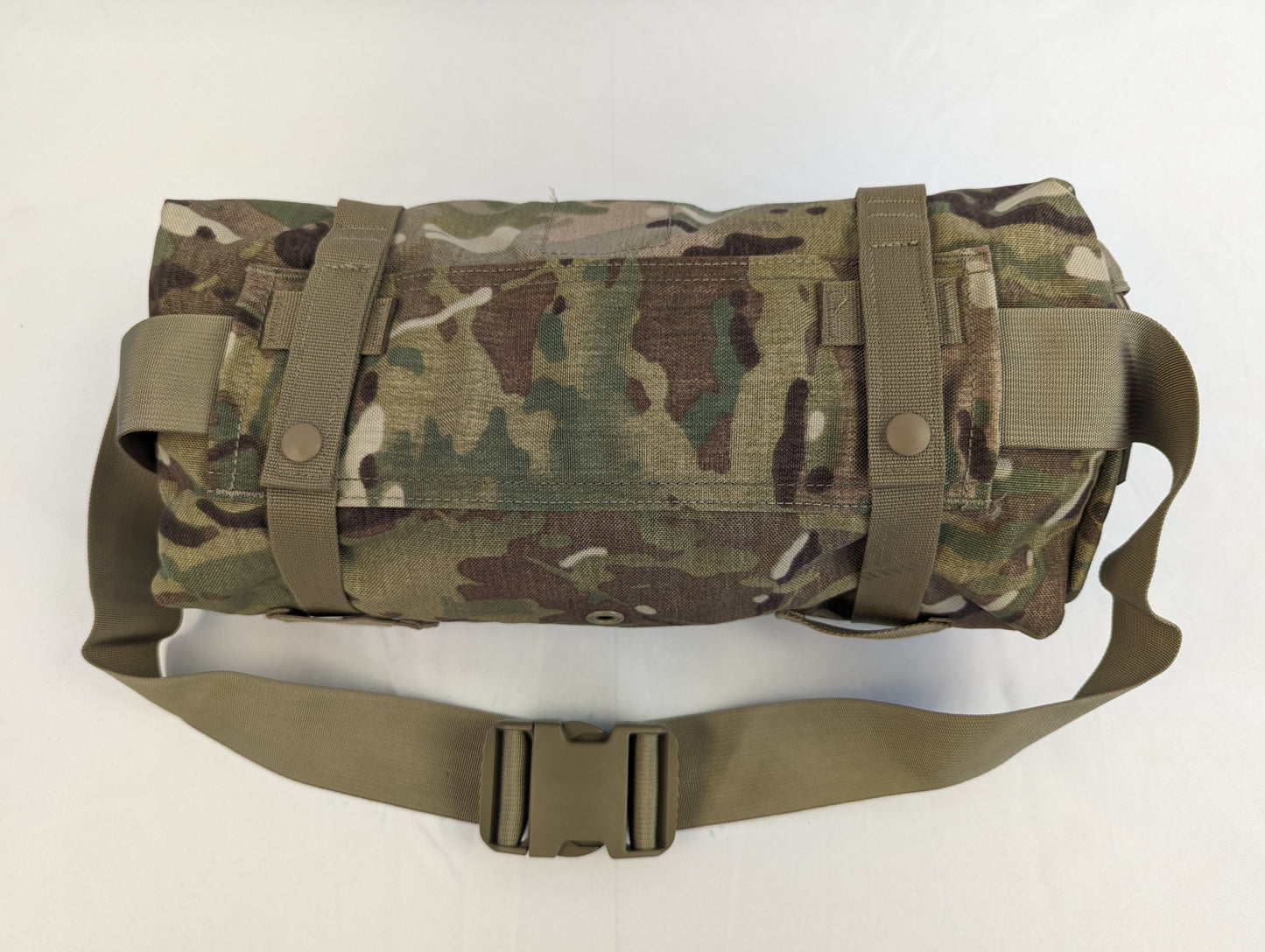 A U.S. Military Surplus OCP/Multicam Waist Pack secured with horizontal compression straps, featuring the khaki waist belt and quick-release buckle in the foreground.