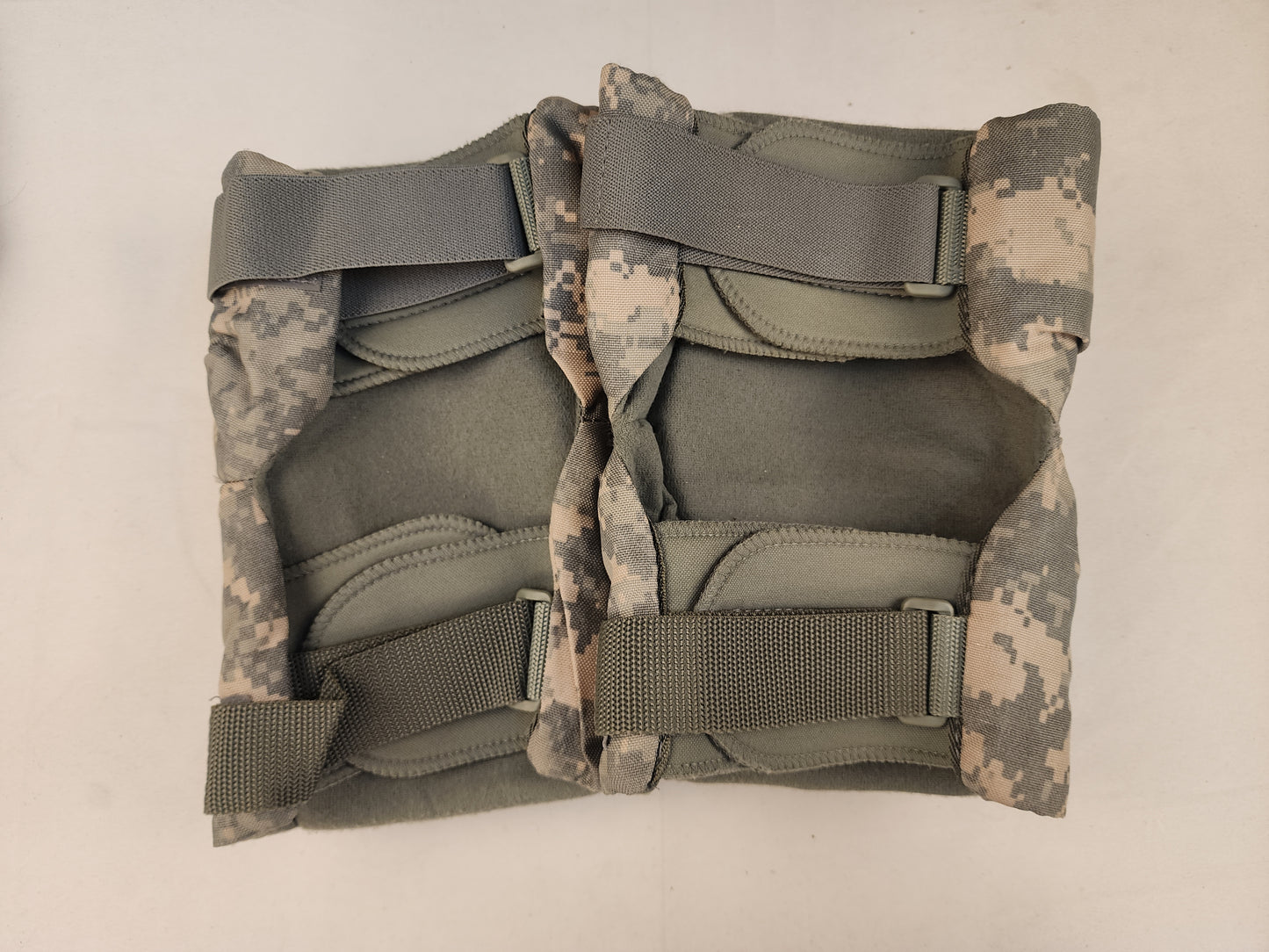Tactical UCP/ACU elbow knee pad sets on a white background