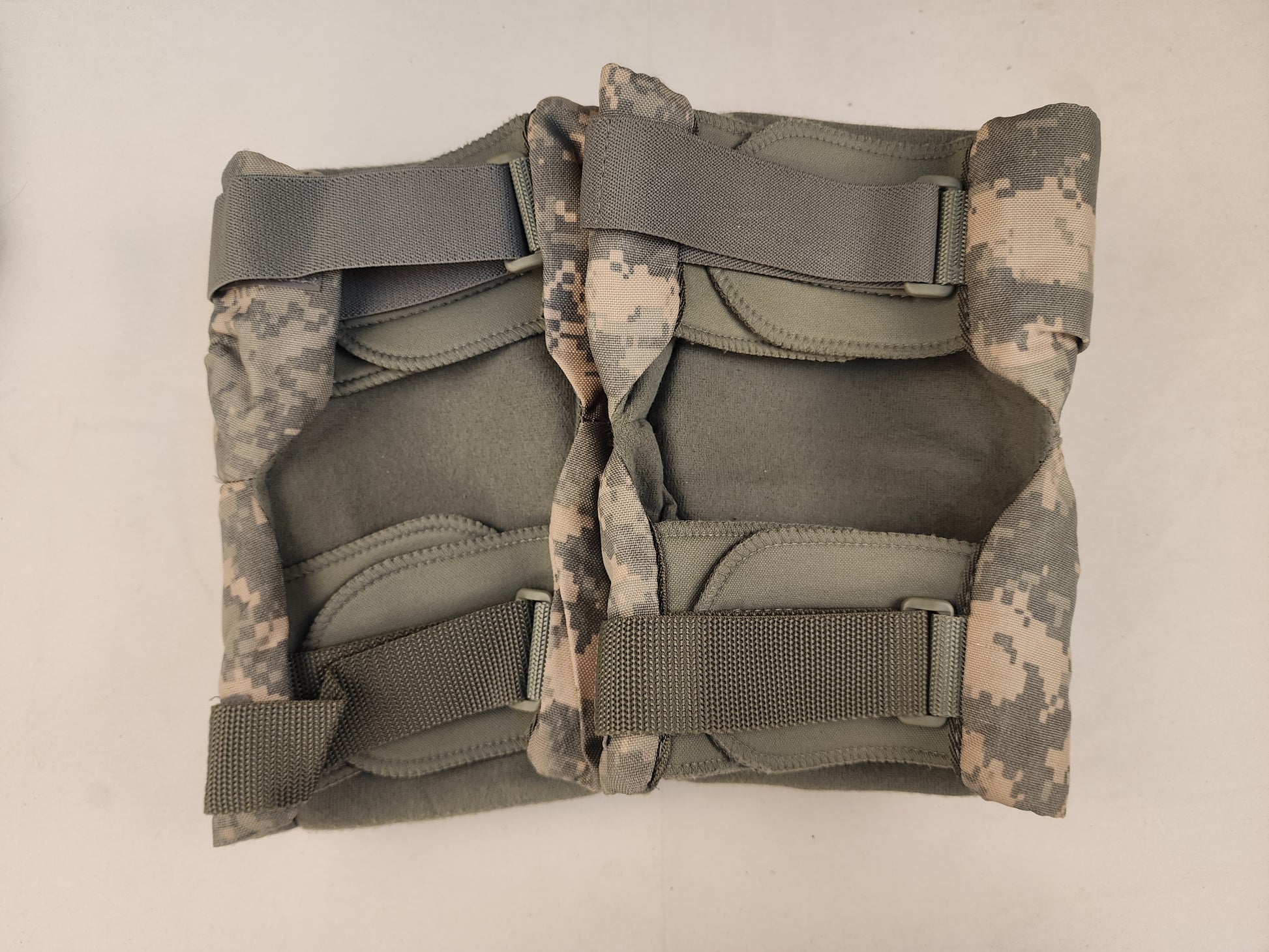 Tactical UCP/ACU elbow knee pad sets on a white background