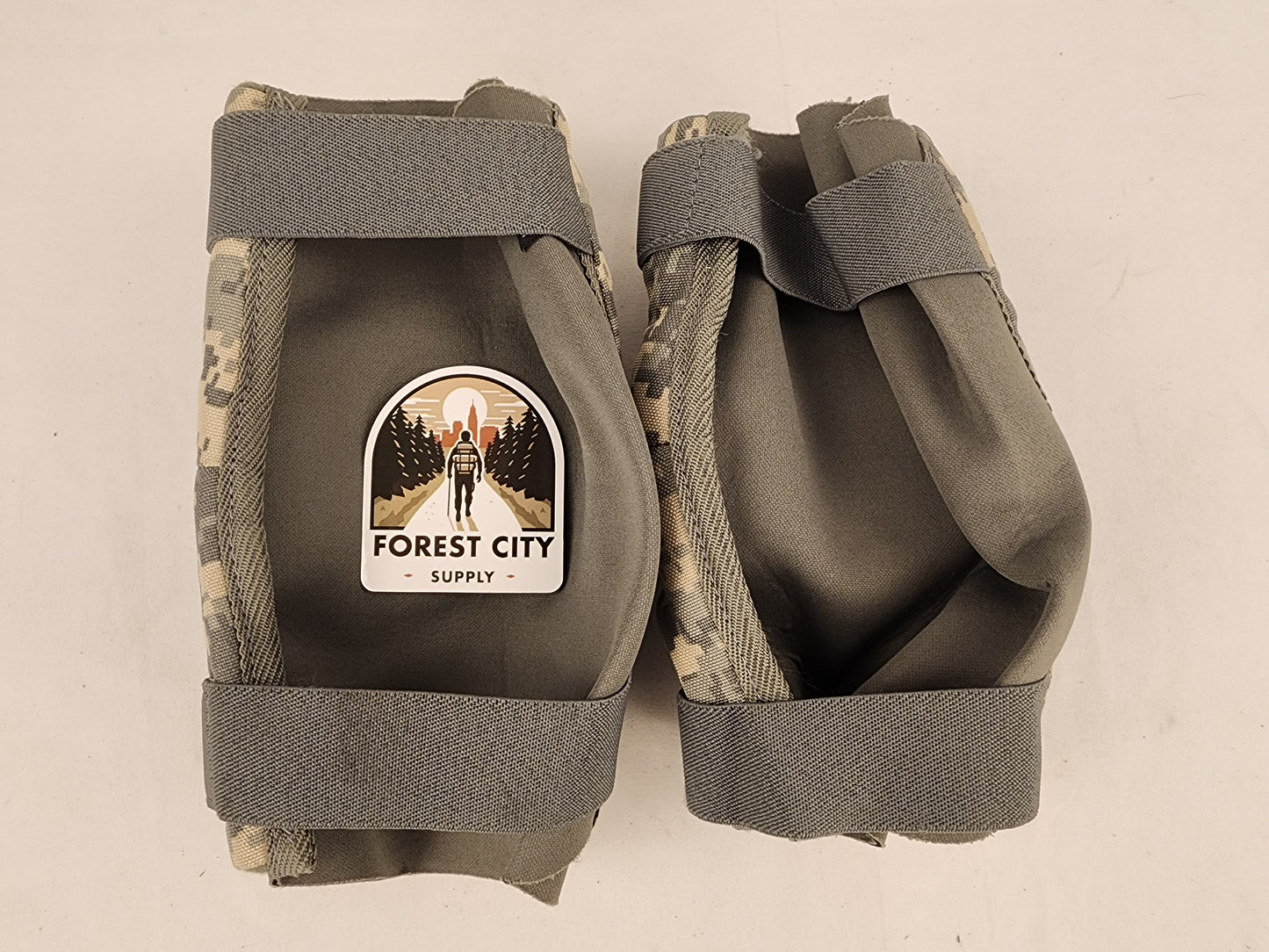 Tactical UCP/ACU camo elbow pads on a white background