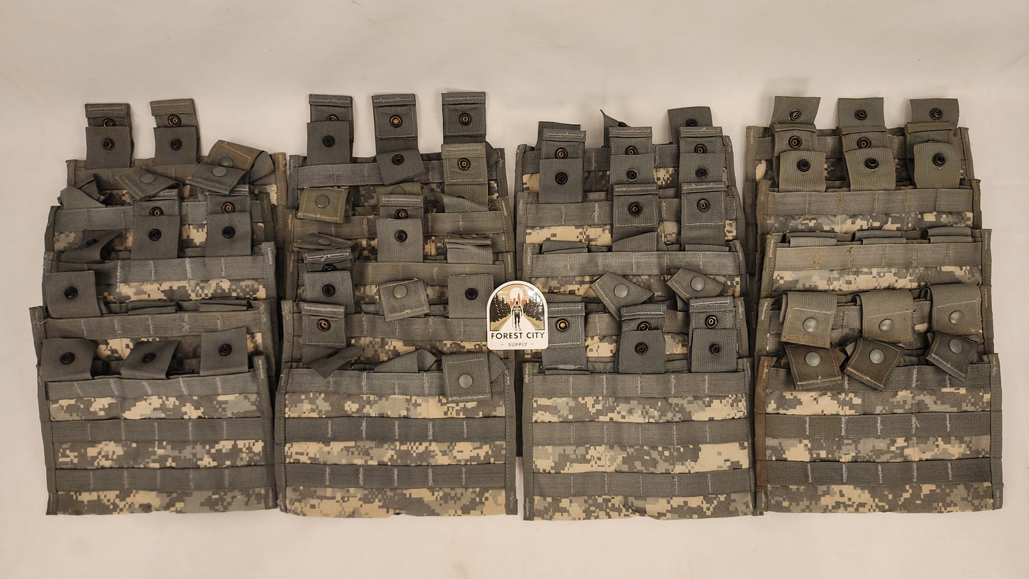 Multiple tactical pouches with a brand label on a white background