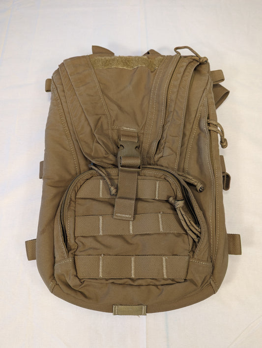 Brown tactical backpack on a white background
