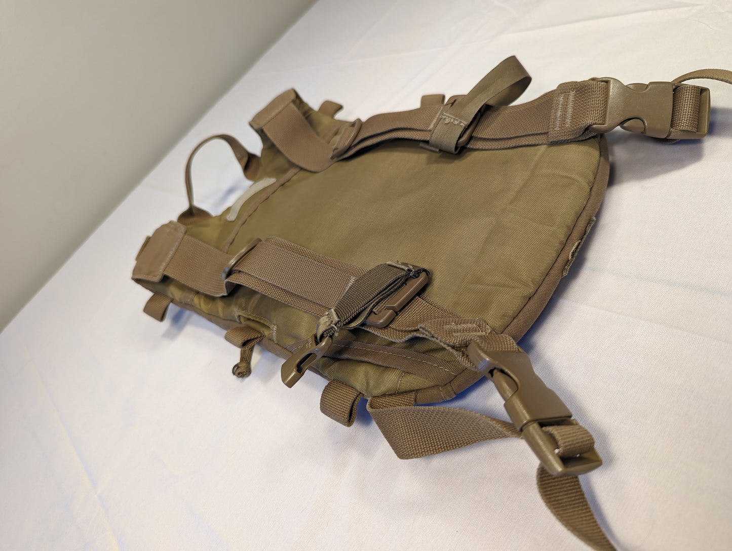 Tan tactical vest on a white background