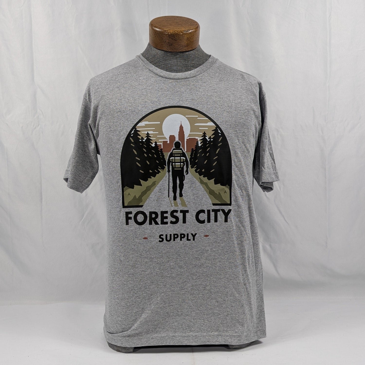 Gray t-shirt with a graphic design on a white background