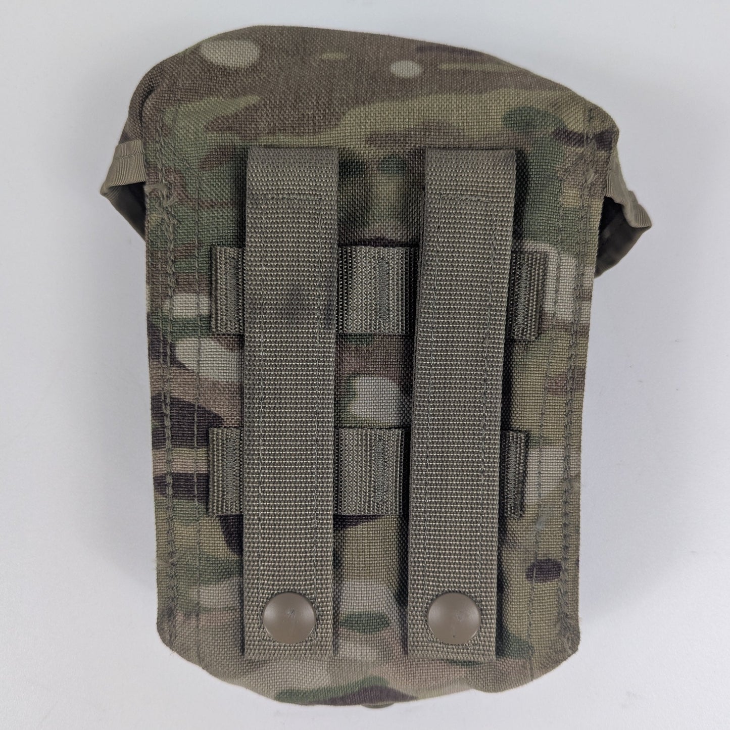 Multicam-patterned tactical pouch with multiple straps on a white background