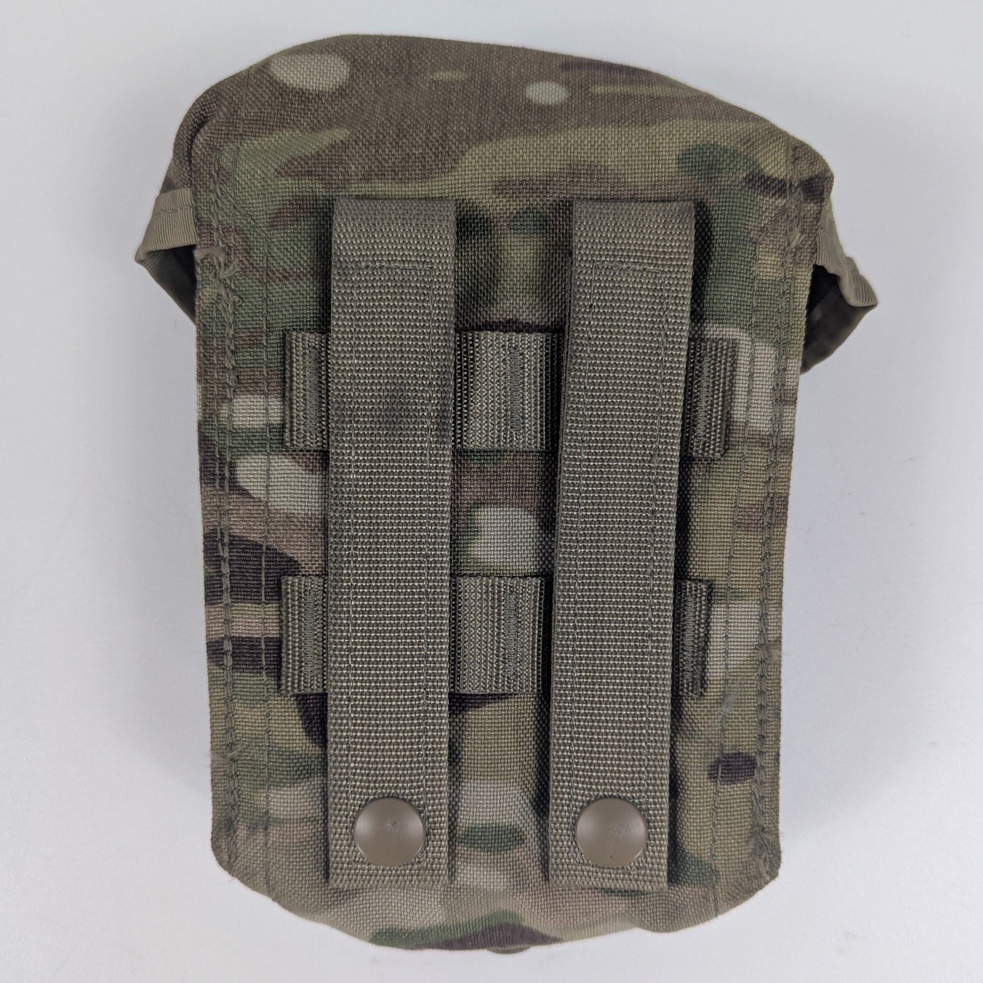 Multicam-patterned tactical pouch with multiple straps on a white background