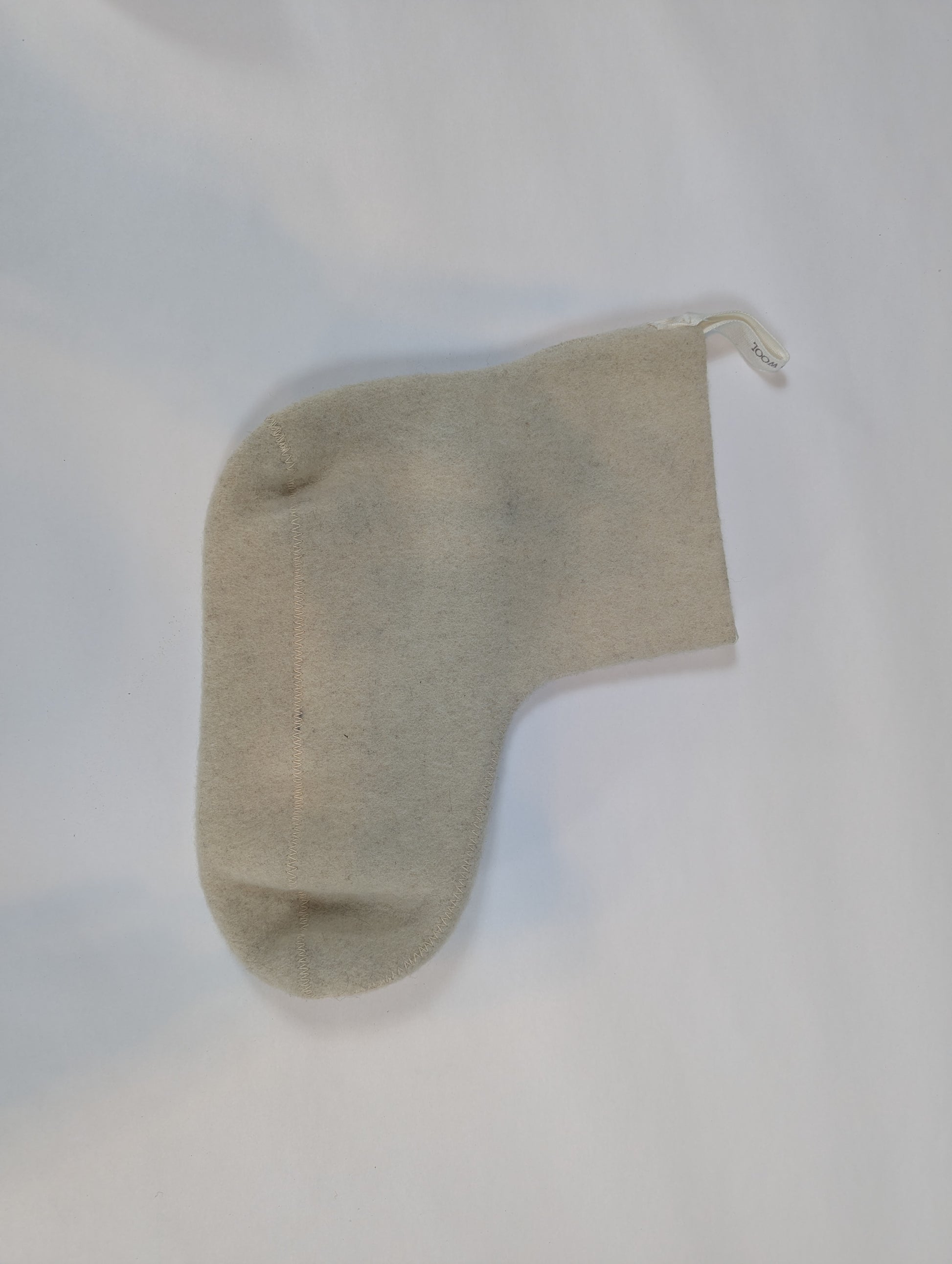 Beige sock on a white background