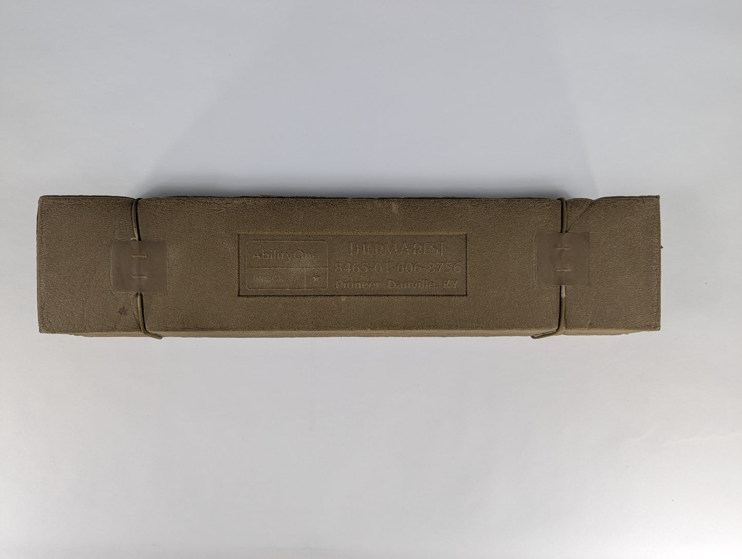 Brown paper package with text on a white background