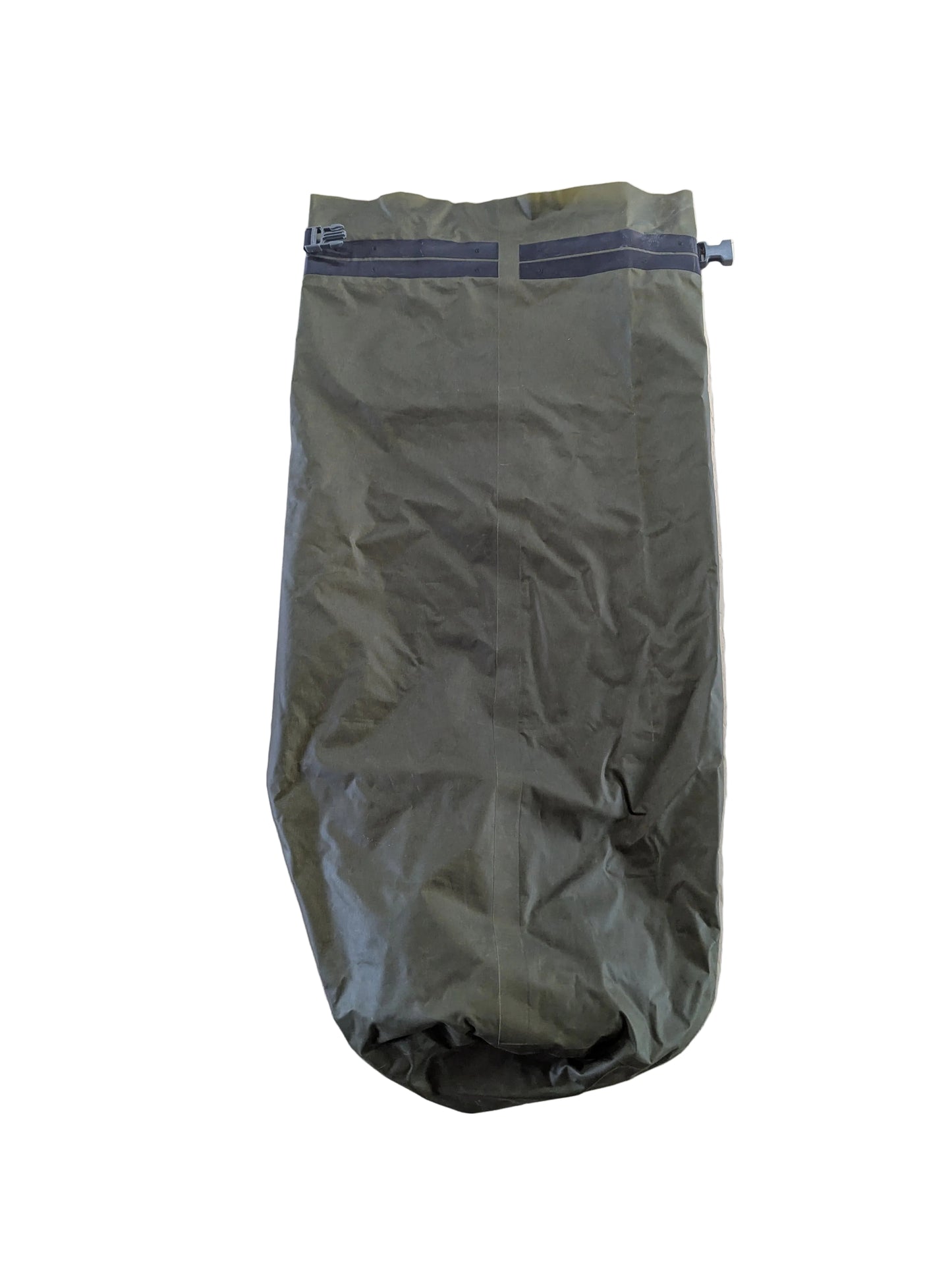 Green sleeping bag on a light wooden surface