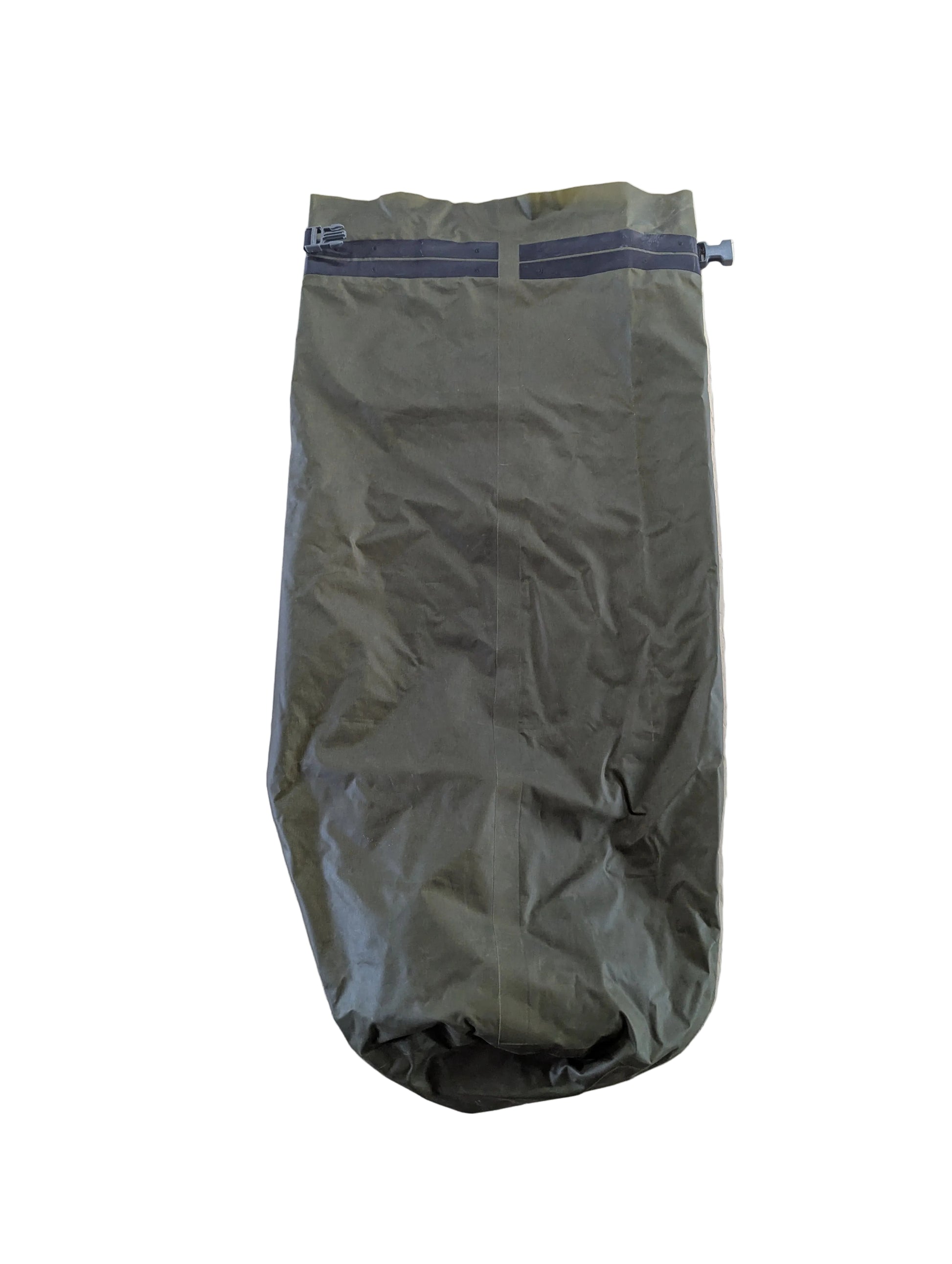 Green sleeping bag on a light wooden surface