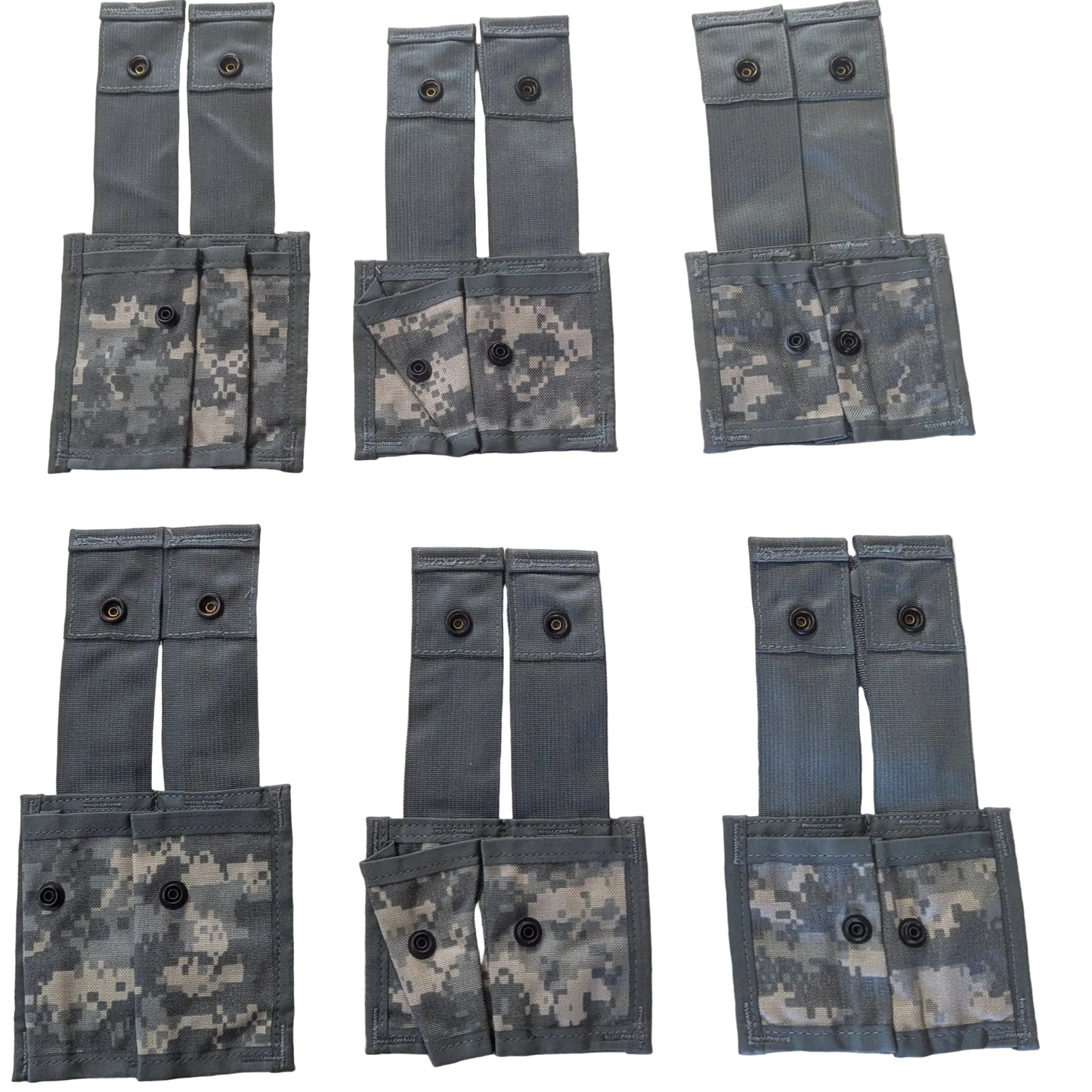 Multiple gray tactical pouches with camouflage patterns arranged on a white surface.