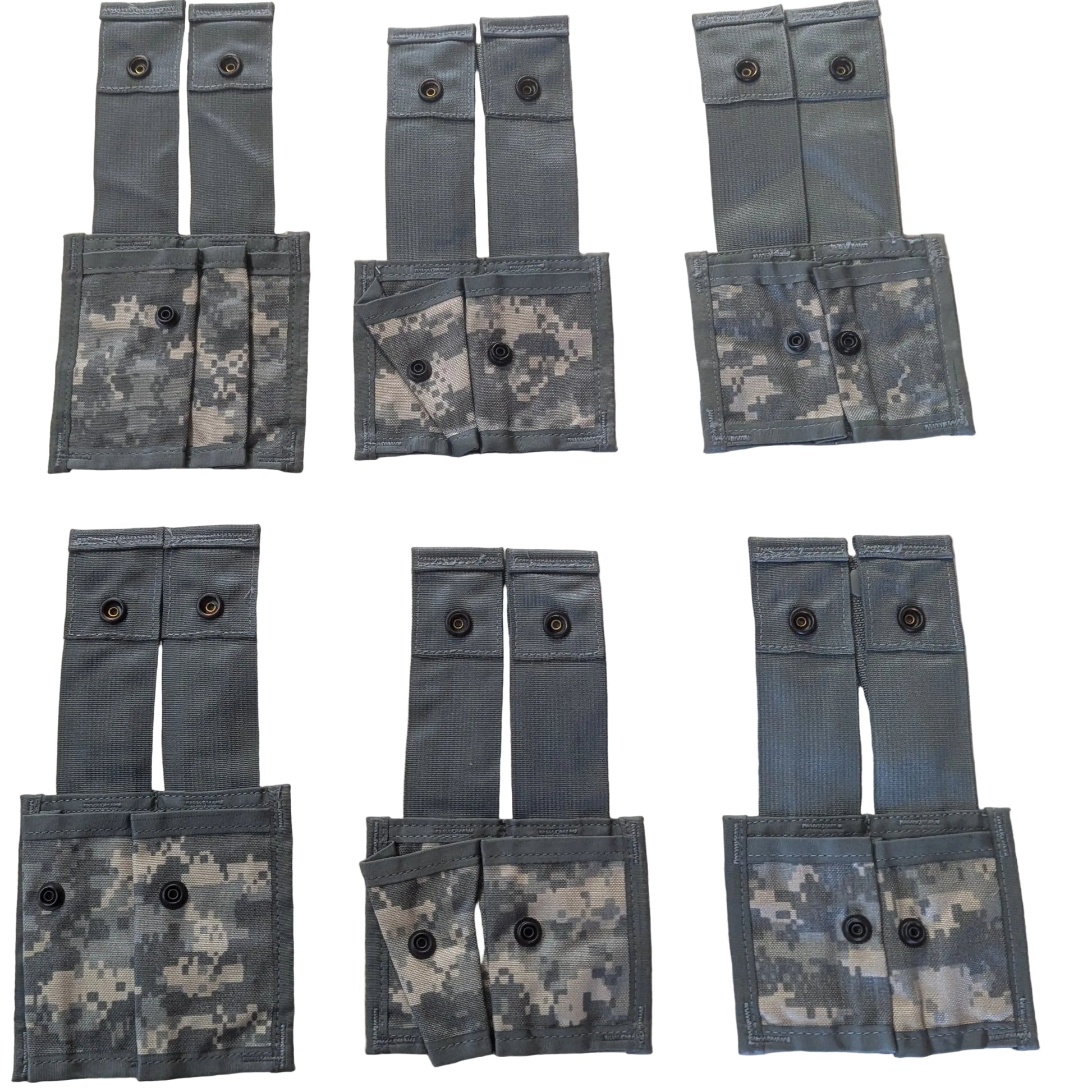 Multiple gray tactical pouches with camouflage patterns arranged on a white surface.