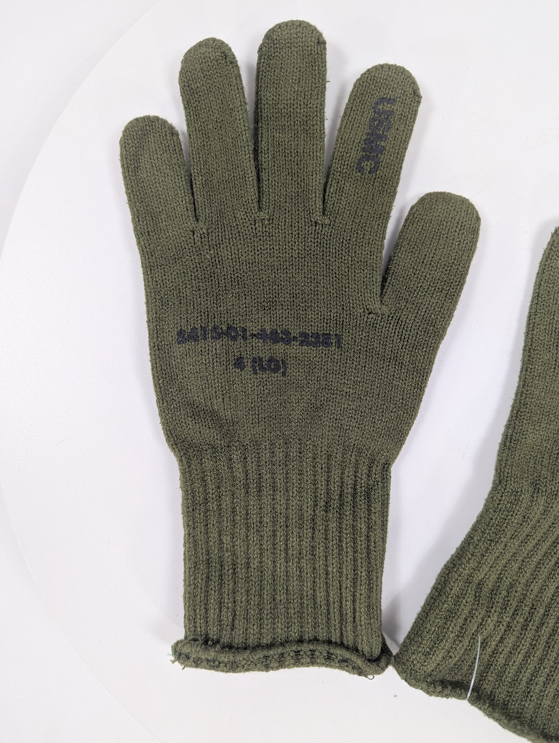 Pair of green gloves with text on a white background