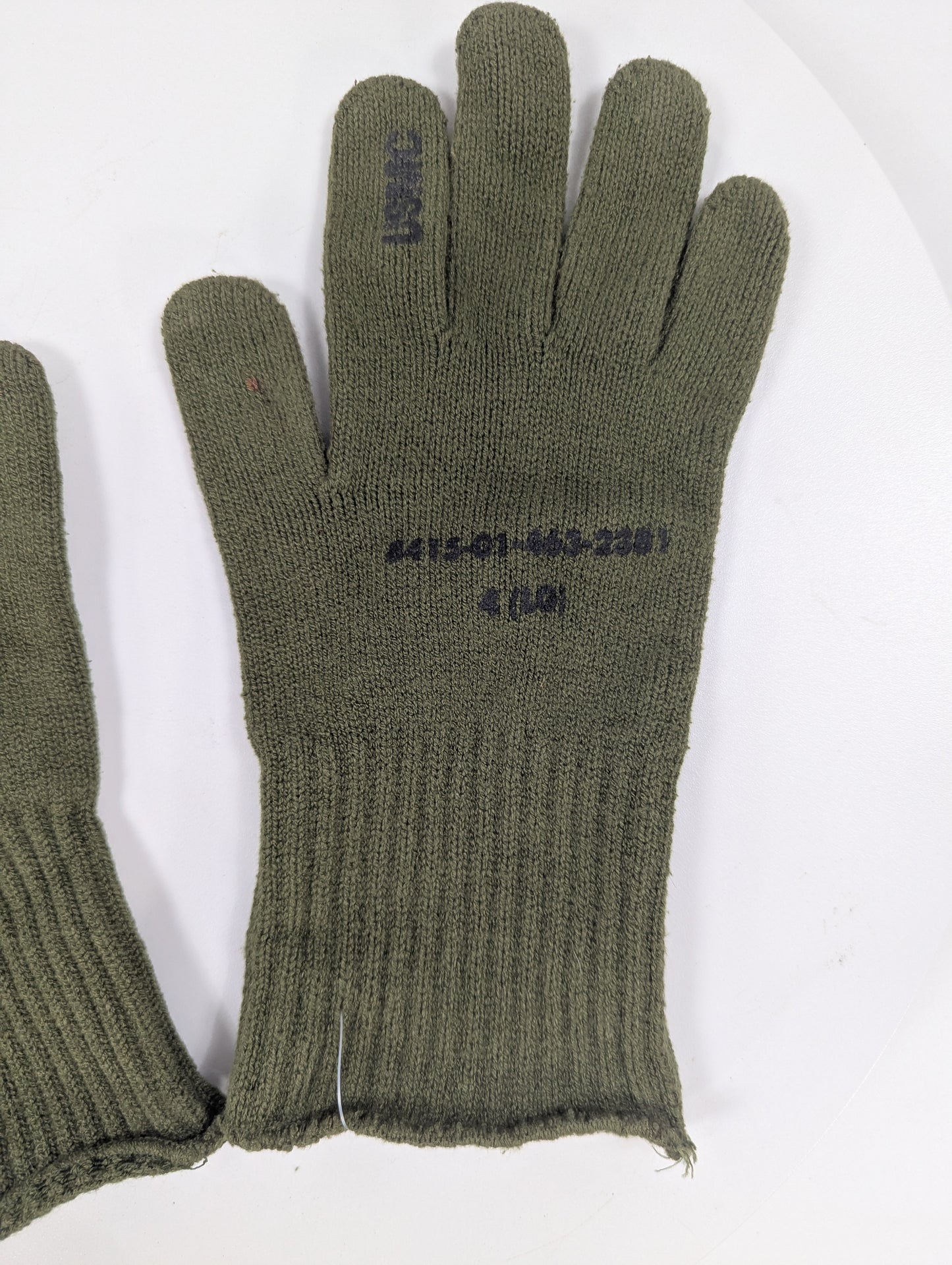 Pair of green gloves with text on a white background