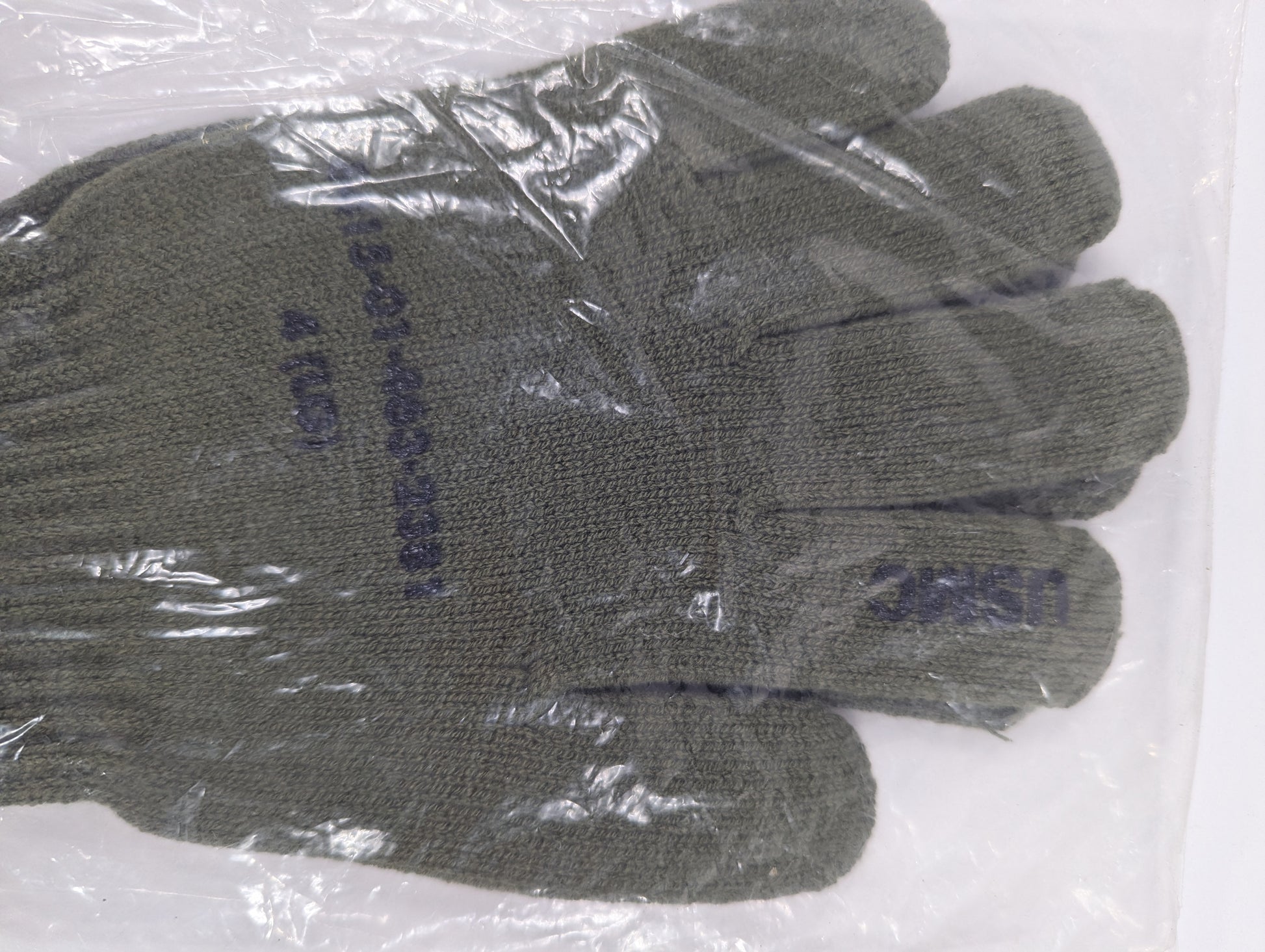 Pair of gray gloves with text on a white background
