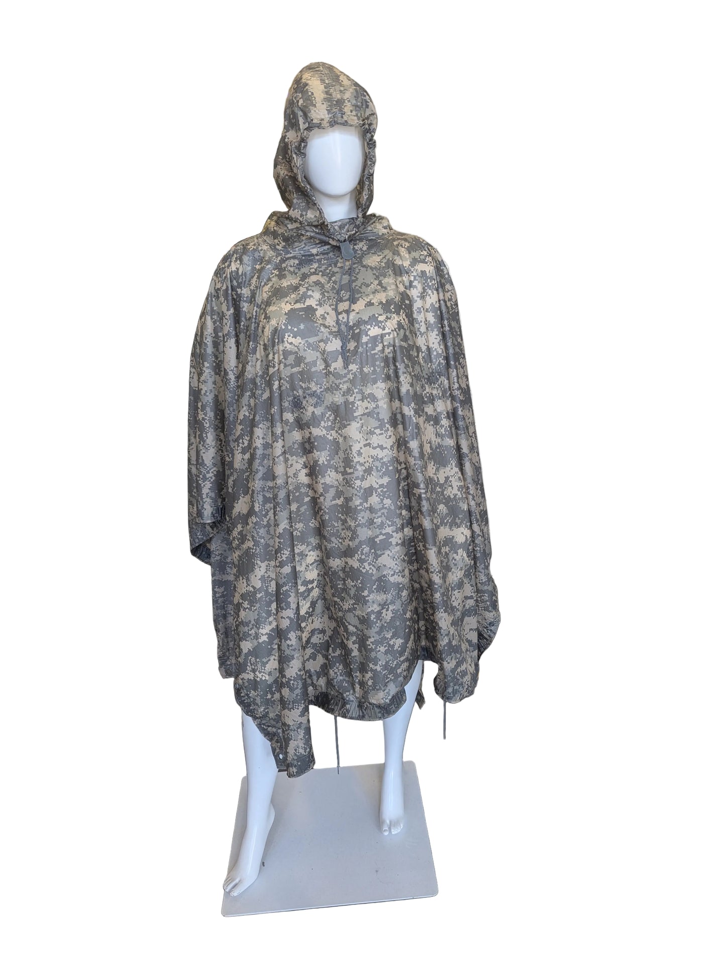 Camouflage hooded poncho on a mannequin