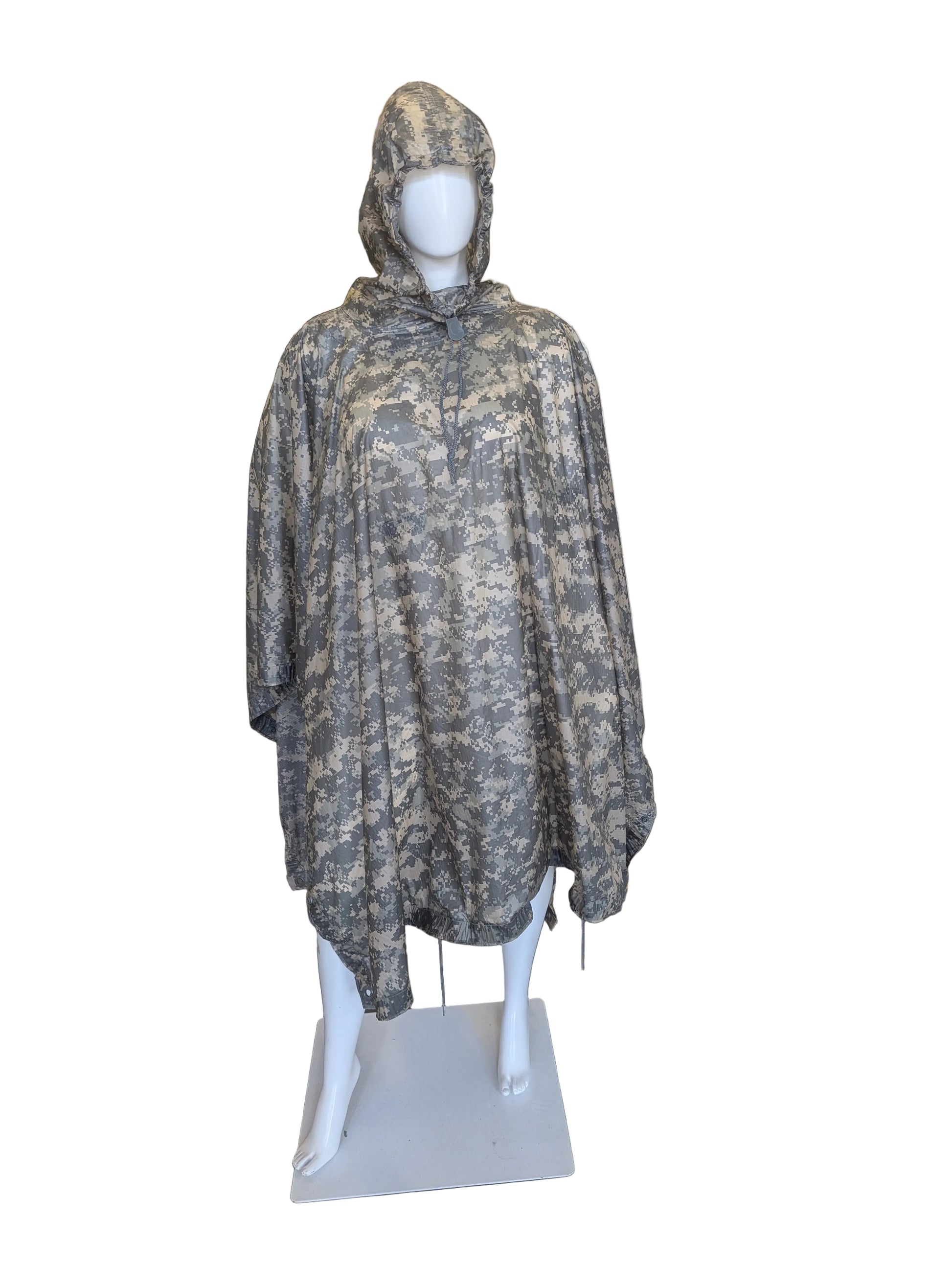 Camouflage hooded poncho on a mannequin