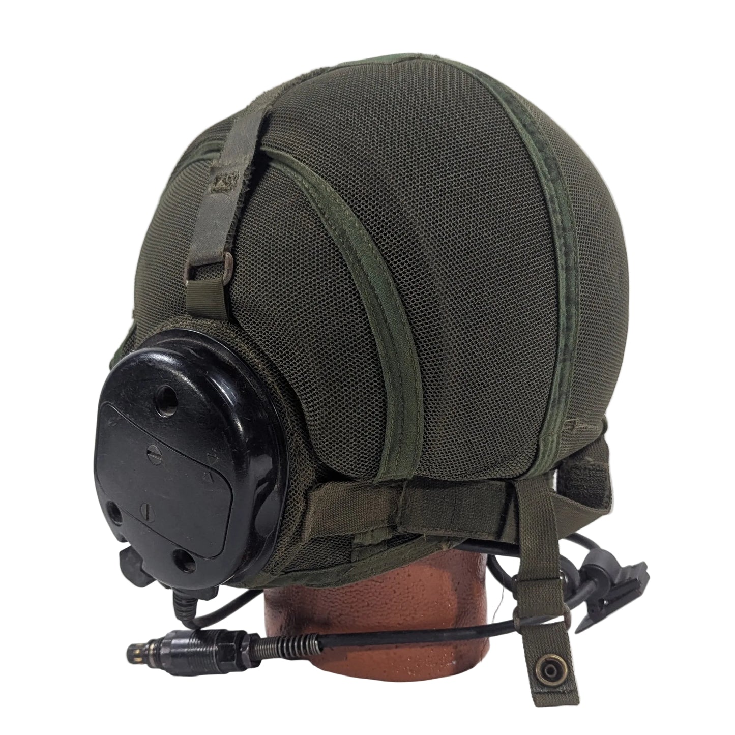 Green military helmet with a black visor on a white background