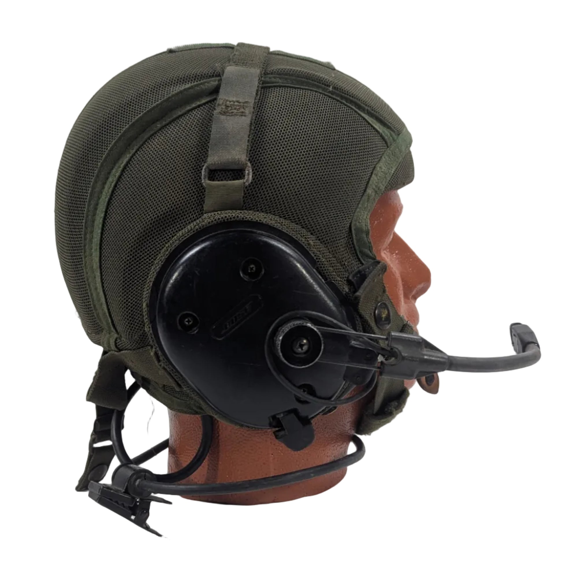 Green military helmet with communication device on a white background