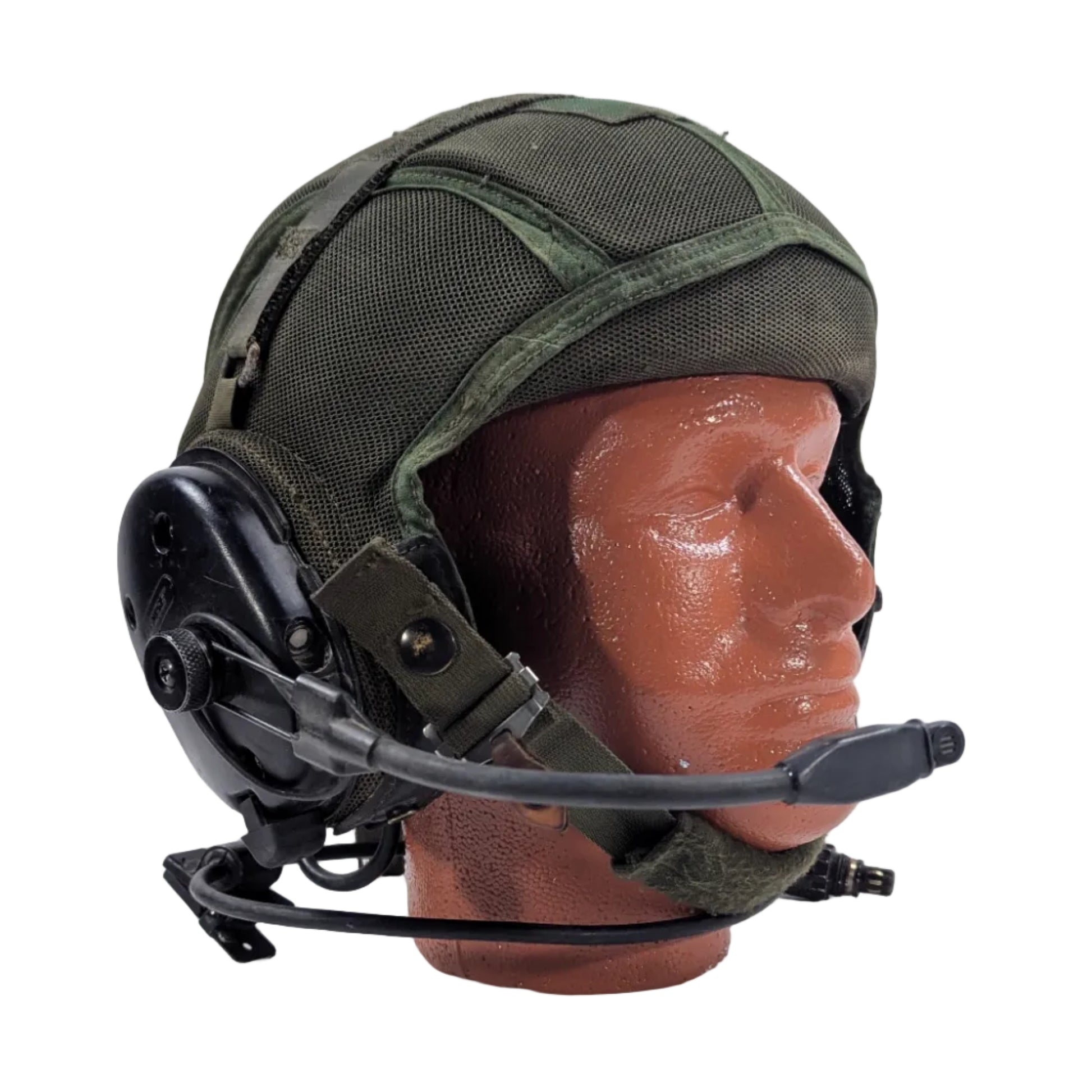 Green helmet with black chin strap on a mannequin head against a white background