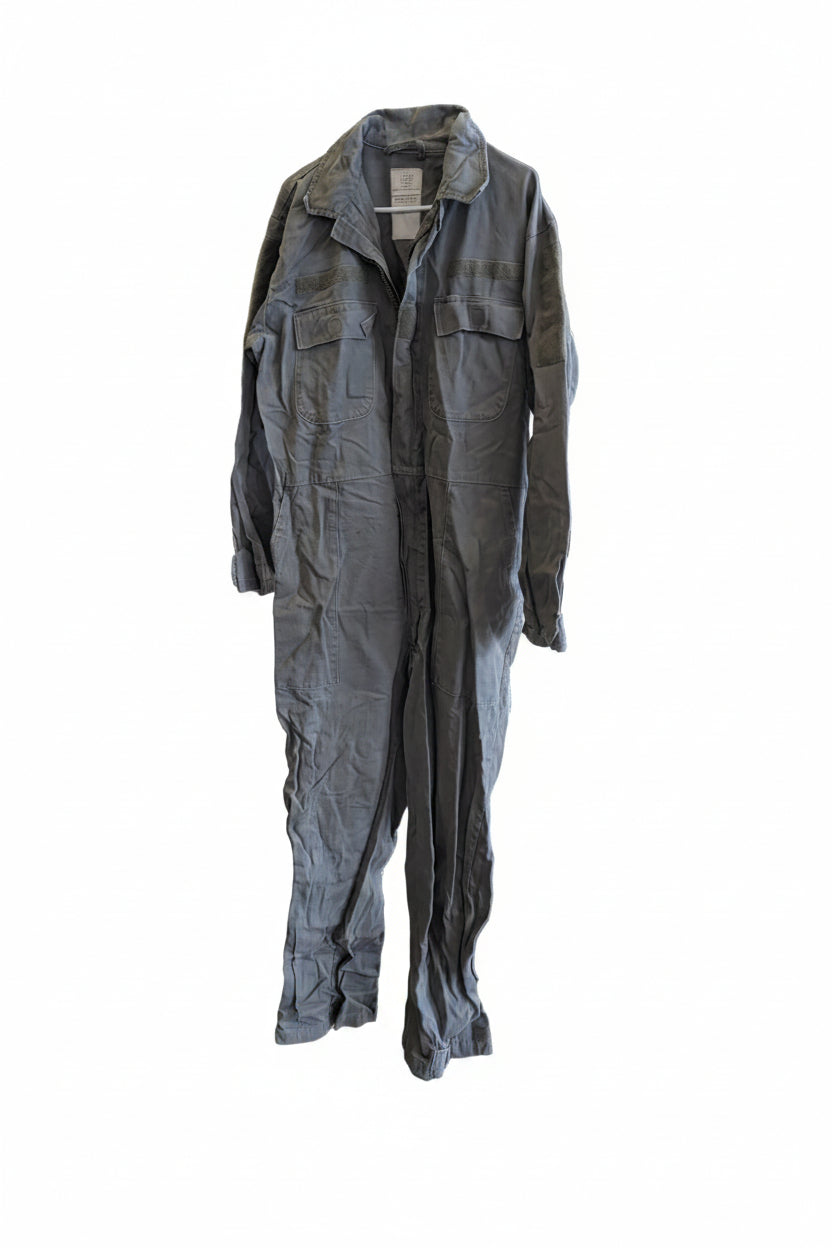 Green jumpsuit on a mannequin against a wall with 'Forest City' branding.