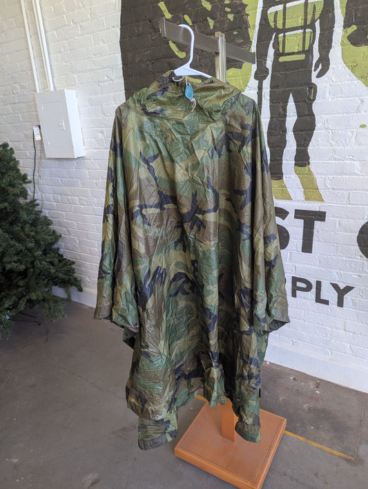 Woodland Poncho hanging in a store.