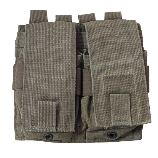A pair of tan tactical utility pouches with MOLLE webbing, laid flat on a light wood surface. 