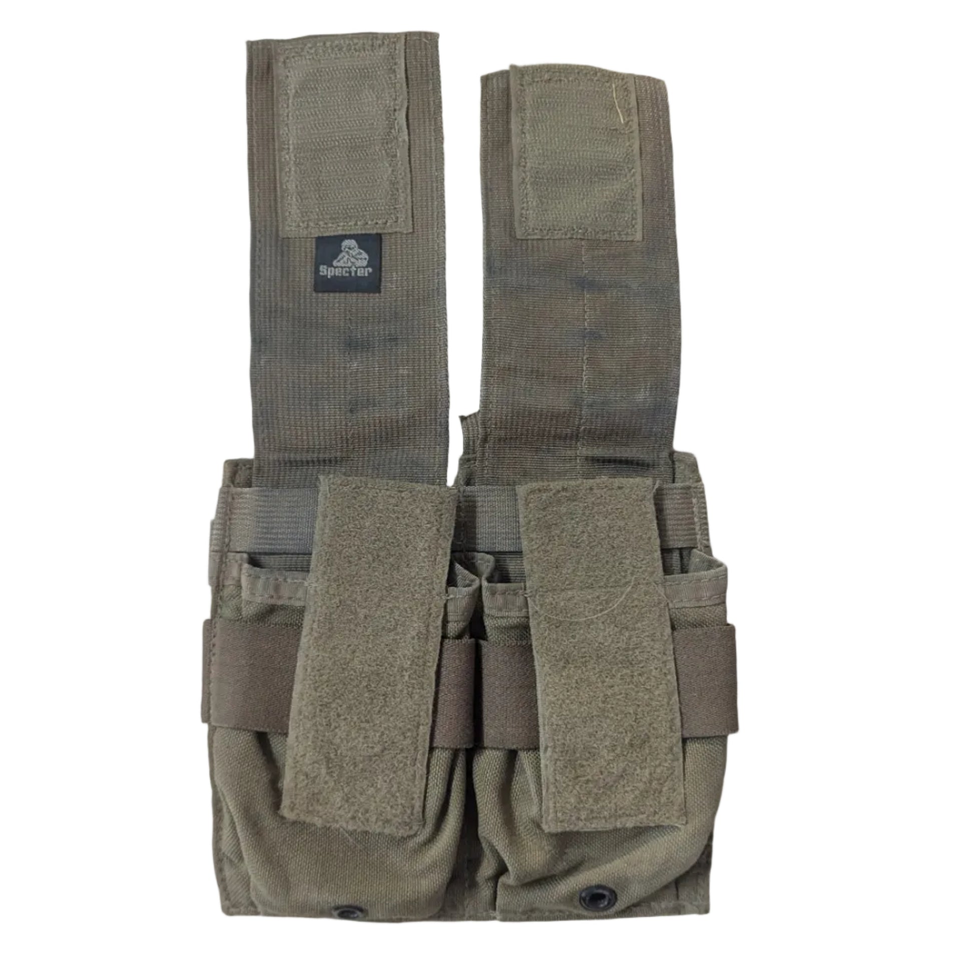 A tan tactical magazine pouch with two front hook-and-loop straps and a vertical flap, laid flat on a light wood surface. 