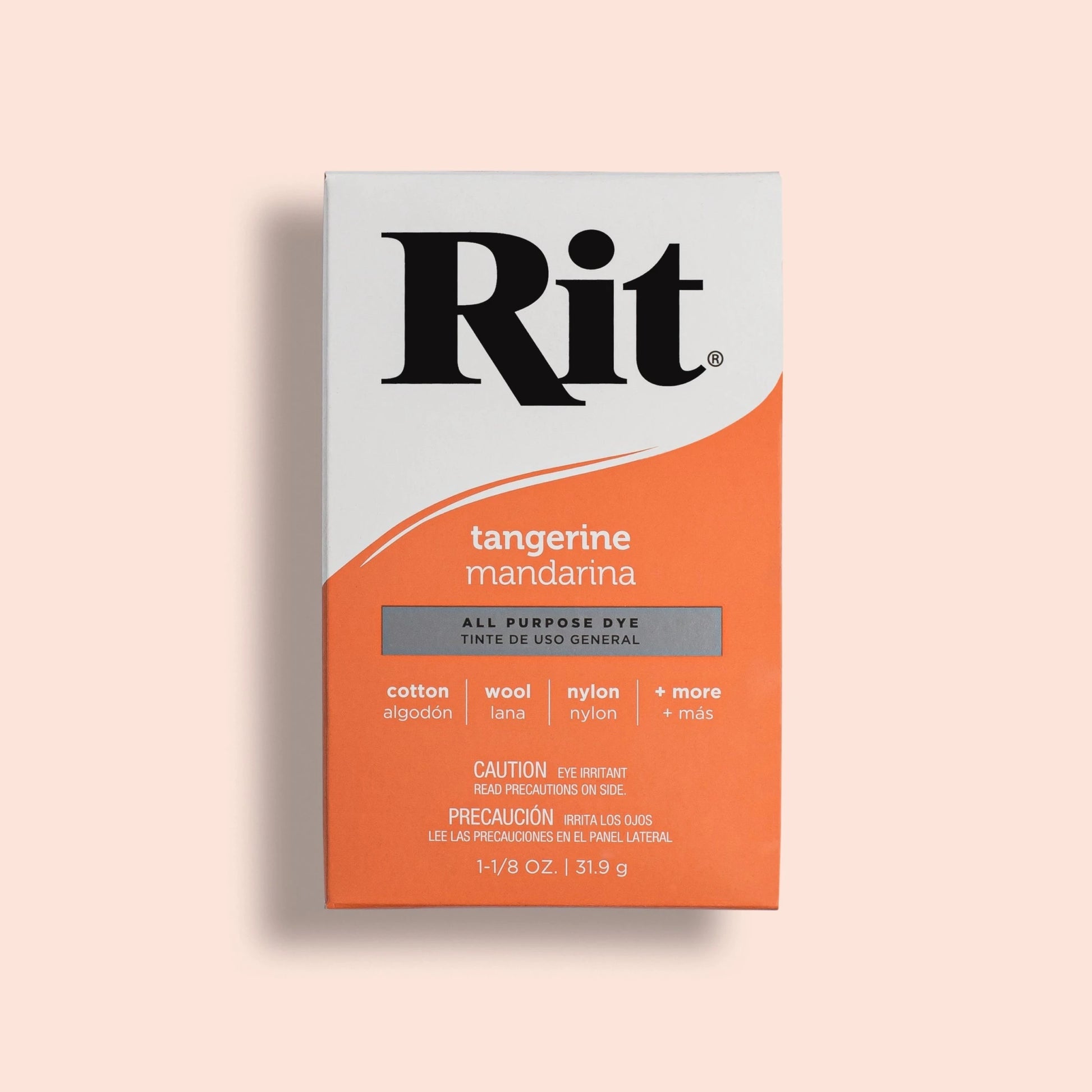 Rit dye box for tangerine color on a light pink background
