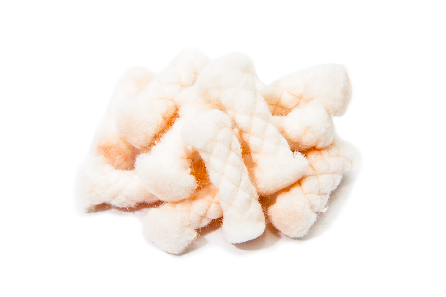 A piece of quickLIGHT tinder, showing a pale, dry, and distinctly fibrous, braided texture against a transparent background.