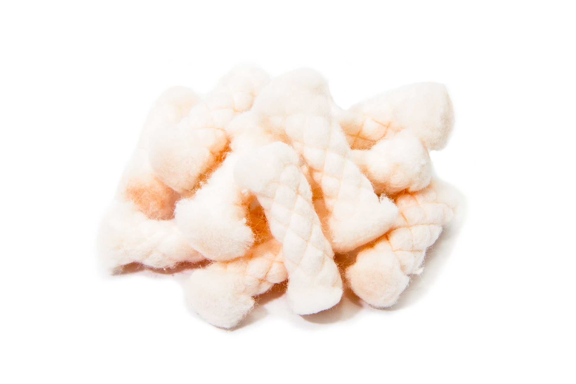 A piece of quickLIGHT tinder, showing a pale, dry, and distinctly fibrous, braided texture against a transparent background.