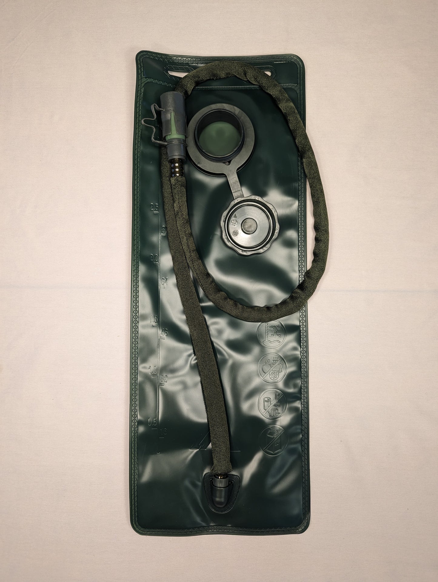 An overhead view of a new, dark olive green 3-Liter hydration bladder, showing the integrated insulated drinking tube, bite valve, large filler cap, and two top carrying loops.