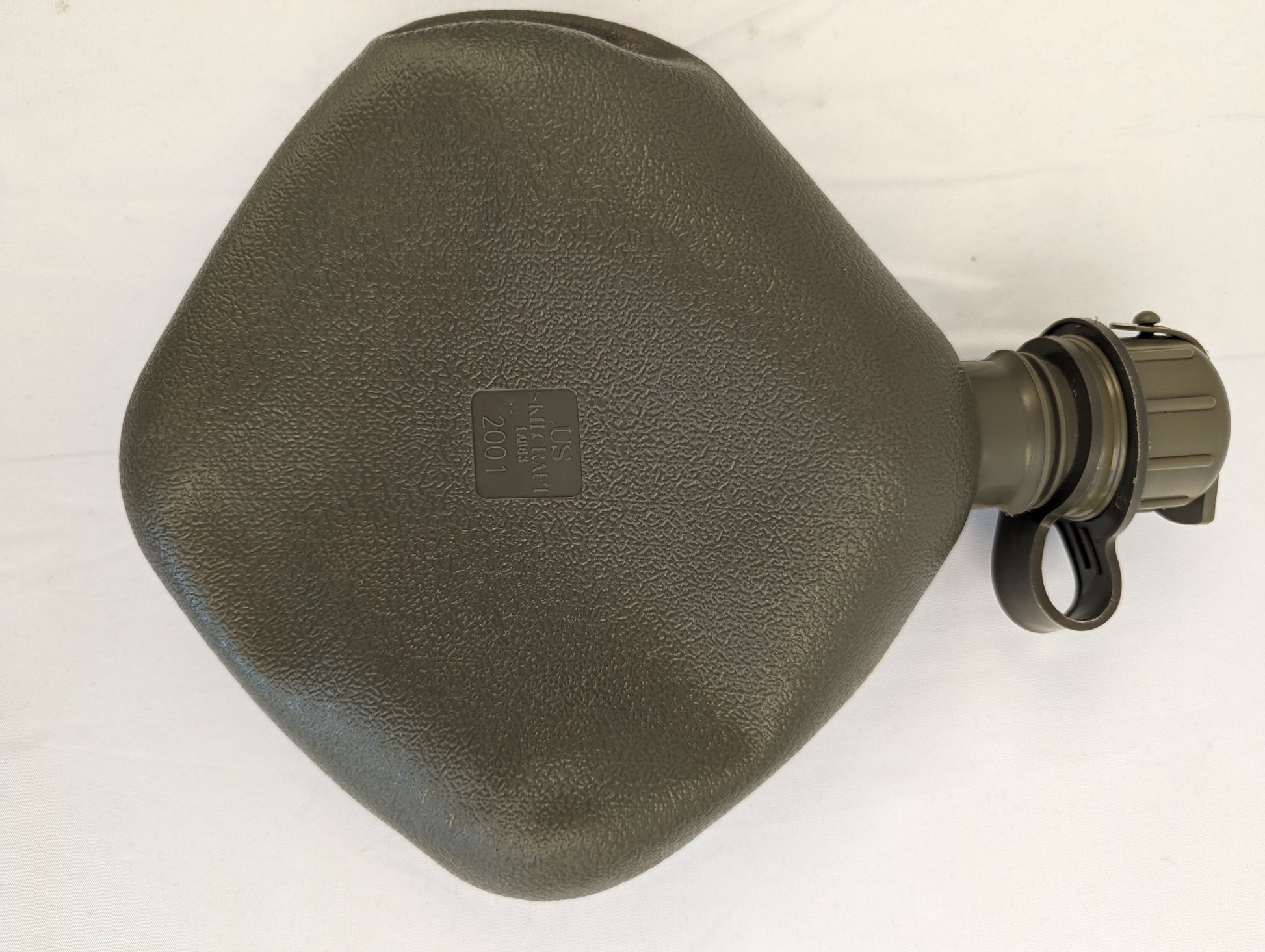A close-up overhead view of a U.S. Military Surplus 2-quart collapsible water canteen in olive drab, displaying the textured body, rigid filler neck, and embossed 'US' and 'SKILCRAFT' markings.
