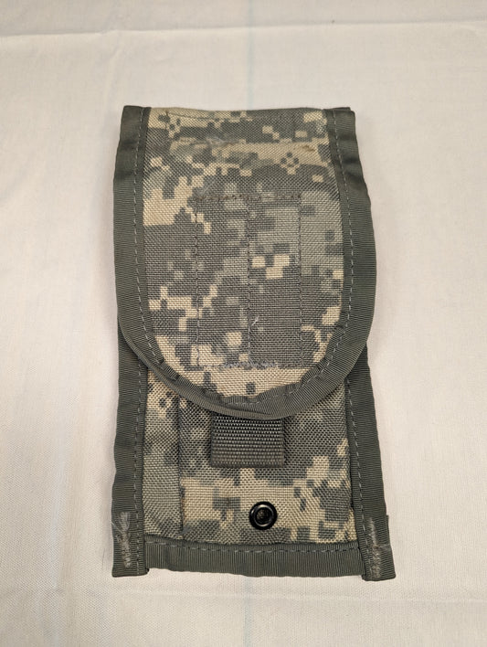 A single U.S. Military Surplus 2-Mag Pouch in ACU/UCP digital camouflage, standing upright and closed, featuring a rounded flap and a black metal snap button closure.