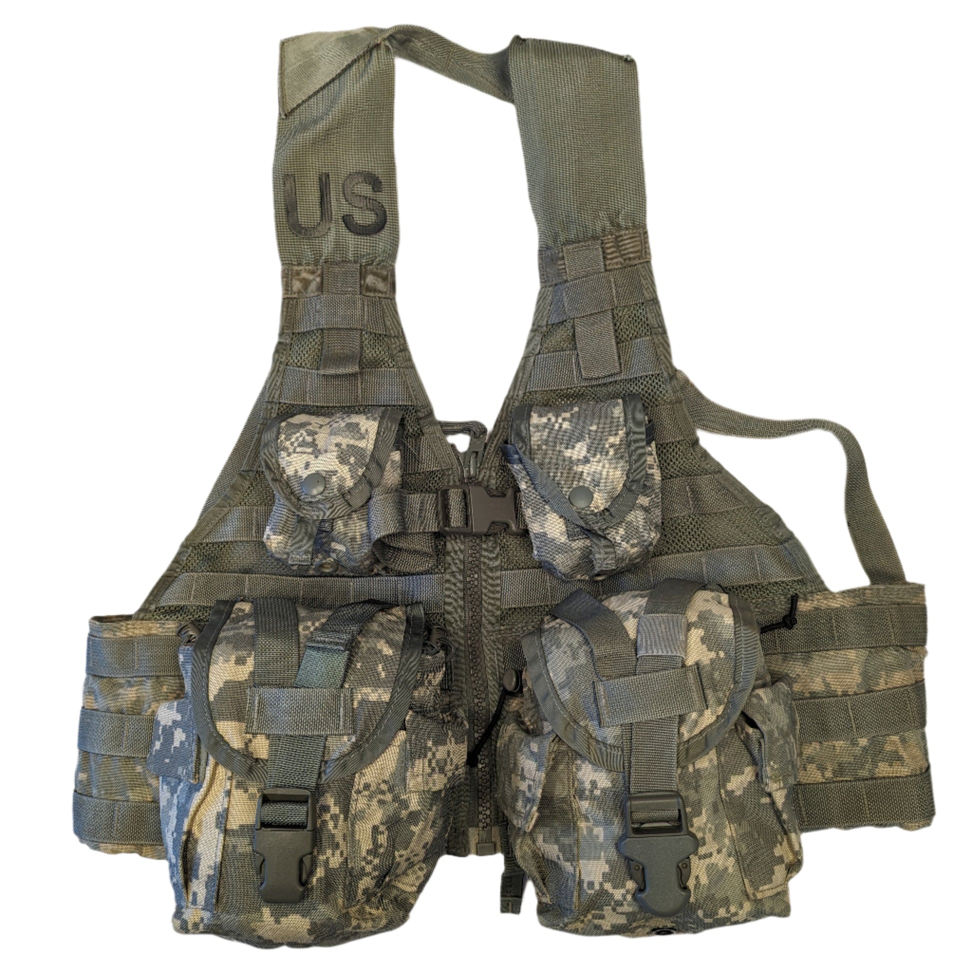 A U.S. Military Surplus Load Carrier Vest (FLC) in ACU digital camouflage, fully assembled with four attached pouches, hanging on a white background, and featuring a prominent stenciled 'US' mark on the chest.