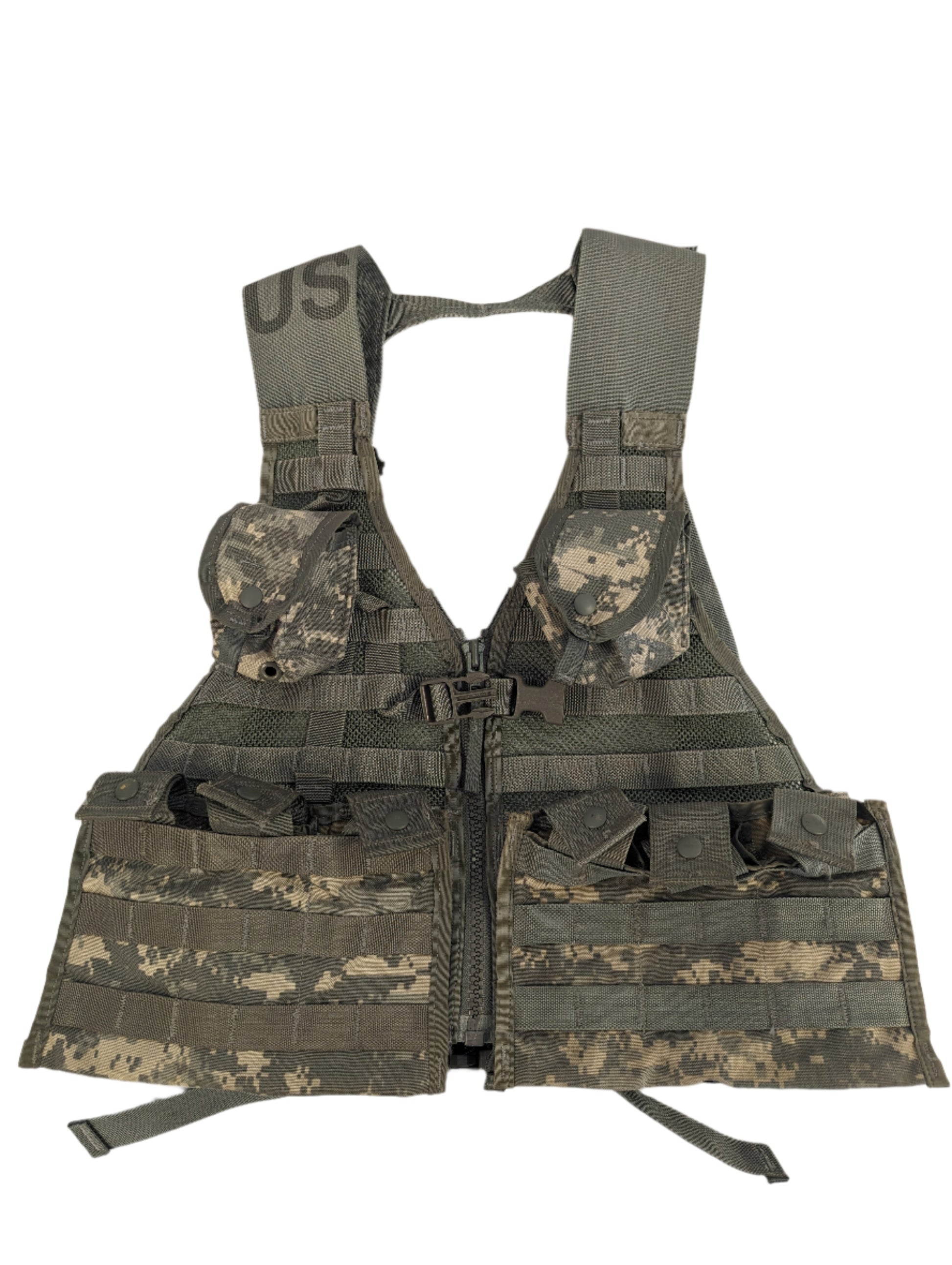 A U.S. Military Surplus Load Carrier Vest (FLC) in ACU digital camouflage, fully assembled and displayed flat, featuring extensive MOLLE webbing, four attached pouches, and a 'US' marking on the chest.