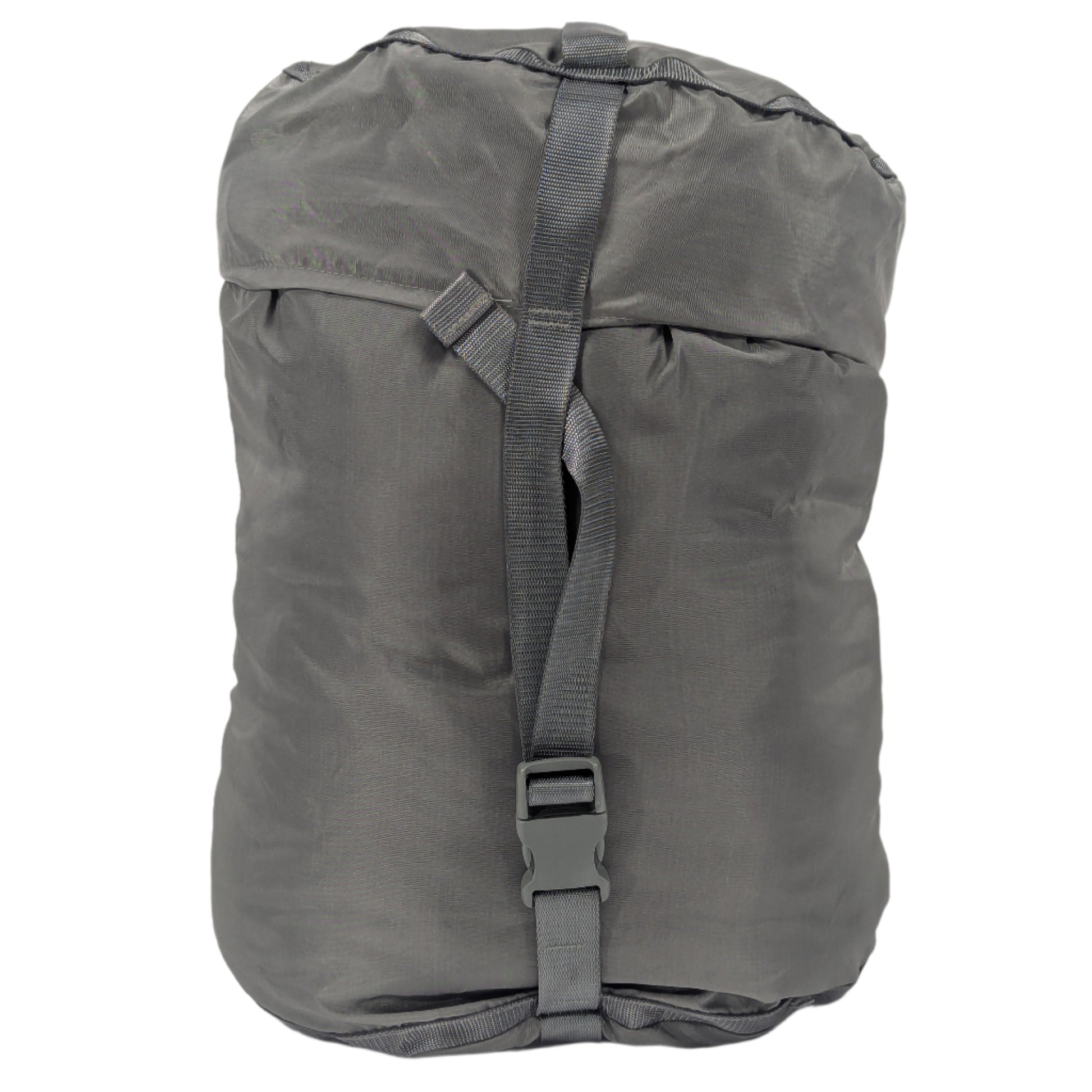 A small U.S. Military Surplus Compression Stuff Sack in foliage green, fully packed and tightly cinched with vertical and horizontal webbing straps and buckles, isolated on a white background.
