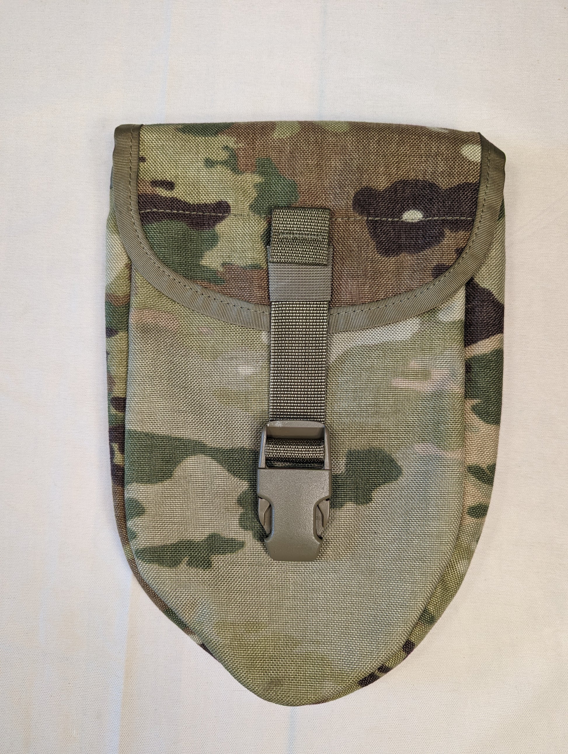 A single U.S. Military Surplus Entrenching Tool Carrier pouch in OCP/Multicam camouflage, featuring a flap secured by a single tan quick-release buckle, photographed on a white background.