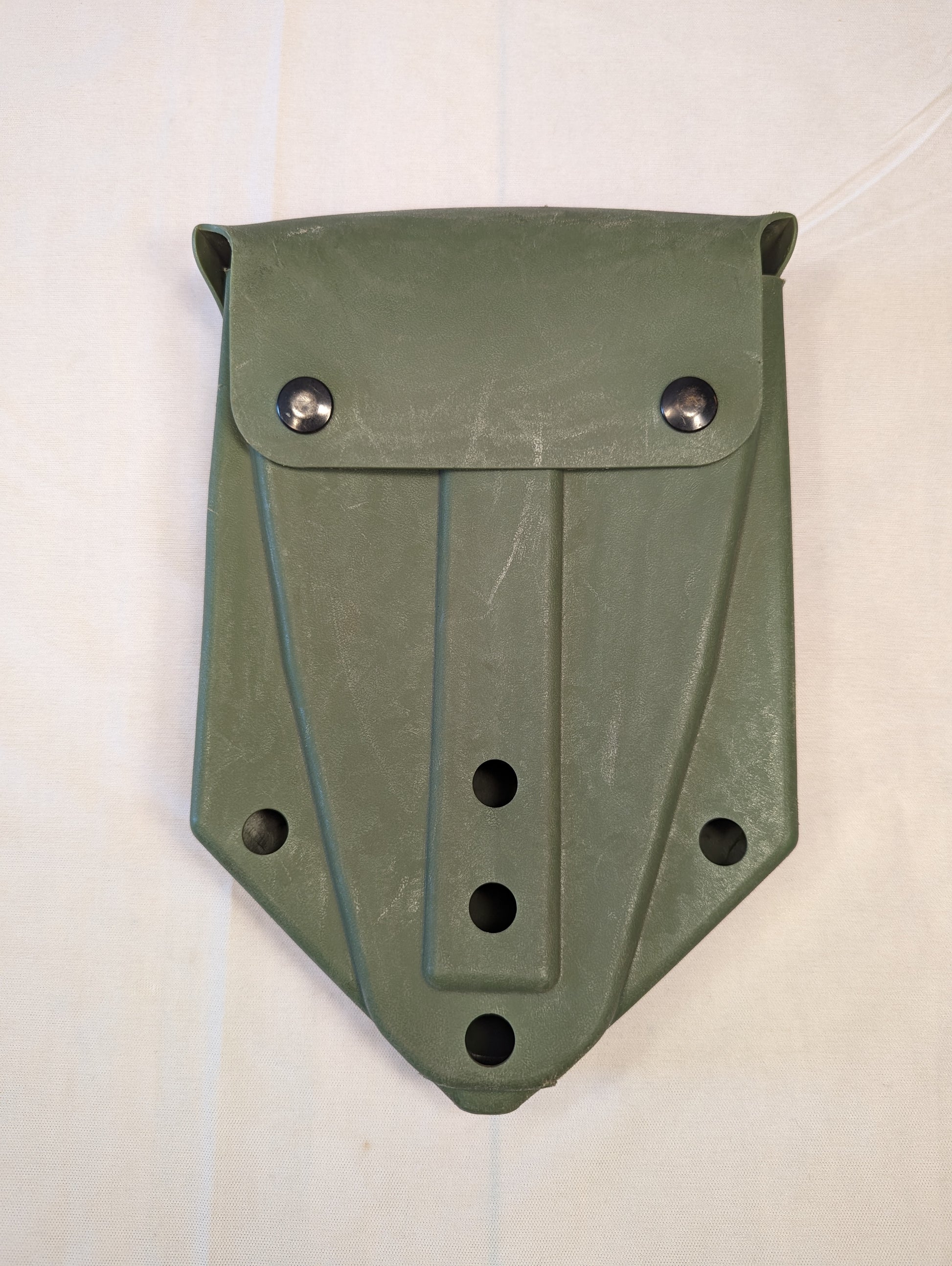 A single U.S. Military Surplus plastic entrenching tool carrier case in olive drab green, standing upright on a white background, featuring a snap-button flap closure and a rugged molded design.