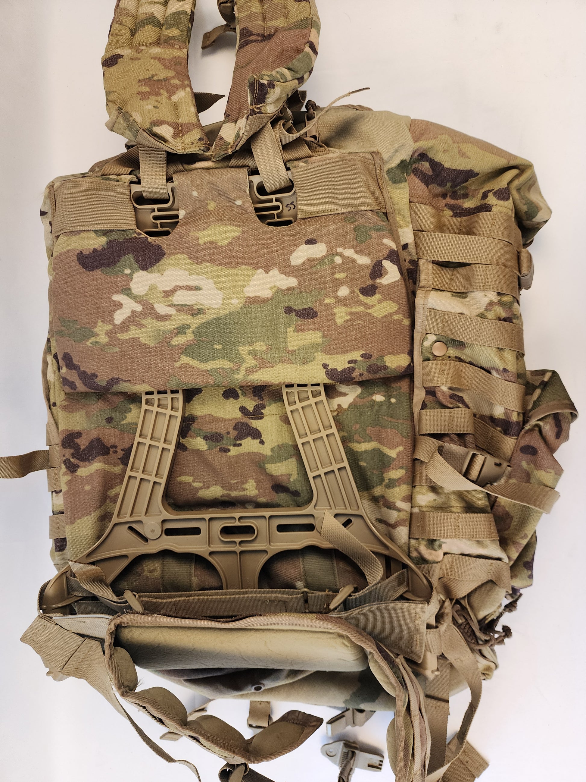 A close-up of the upper front panel of the OCP/Multicam MOLLE 4000 Rucksack, highlighting the heavy-duty quick-release buckles, webbing, and accessory pockets.