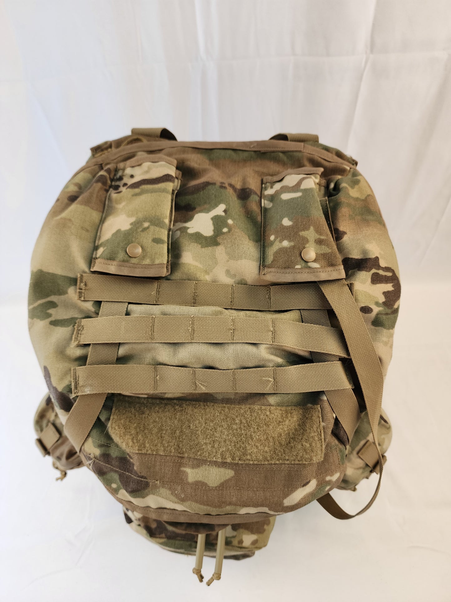 A large U.S. Military Surplus MOLLE 4000 Rucksack in OCP/Multicam camouflage, shown from the top on a white background, highlighting the compression straps and horizontal webbing.