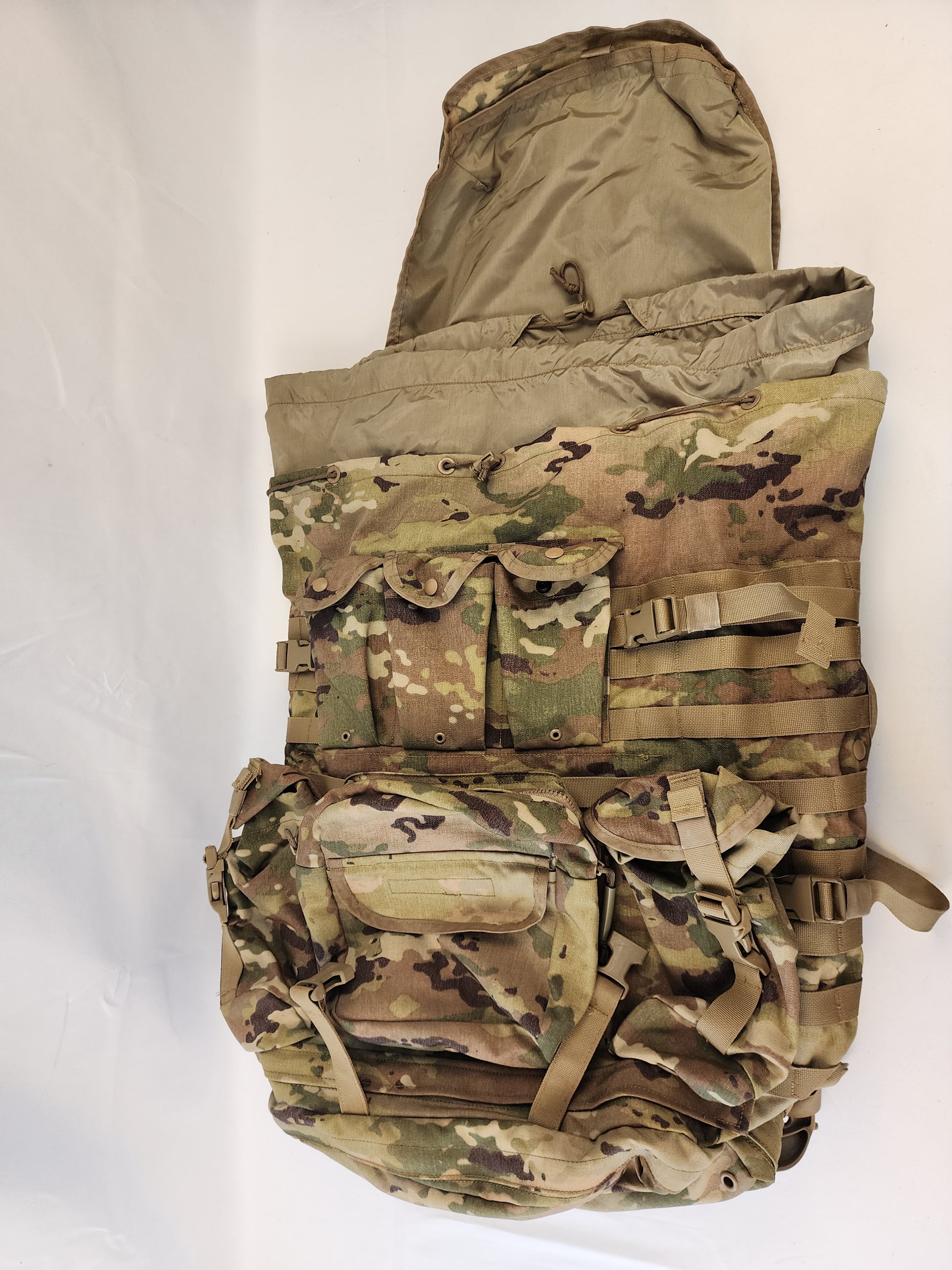 A large U.S. Military Surplus MOLLE 4000 Rucksack in OCP/Multicam camouflage, shown from an overhead view with the top lid open and the main compartment collar cinched tight.