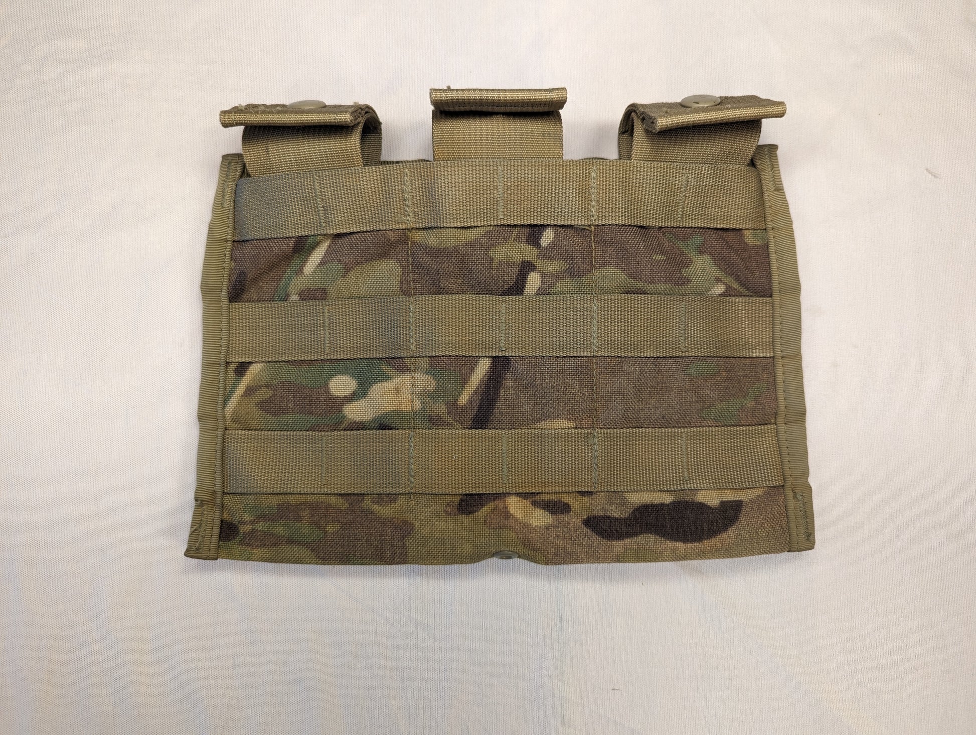 A U.S. Military Surplus MOLLE II Triple Magazine Pouch in Multicam/OCP camouflage, featuring three side-by-side cells with secured flap closures and horizontal MOLLE webbing.