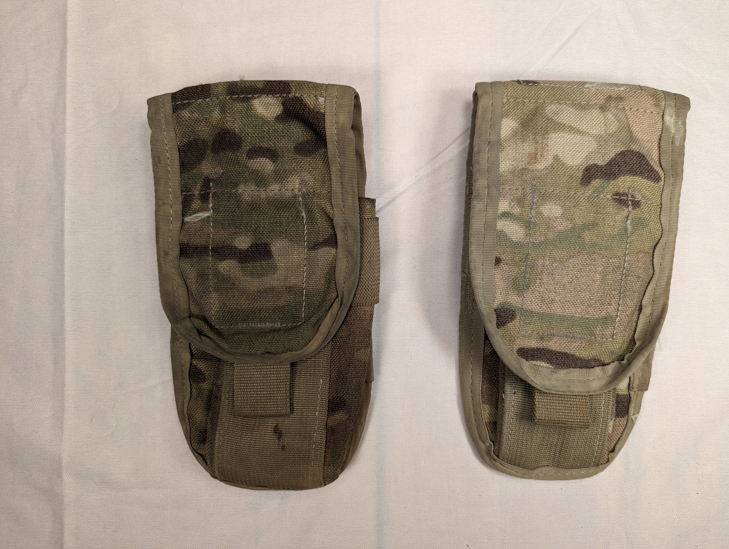 Two U.S. Military Surplus MOLLE II Double Magazine Pouches in OCP/Multicam camouflage, laid side-by-side on a white background, featuring hook-and-loop flap closures and pull tabs.