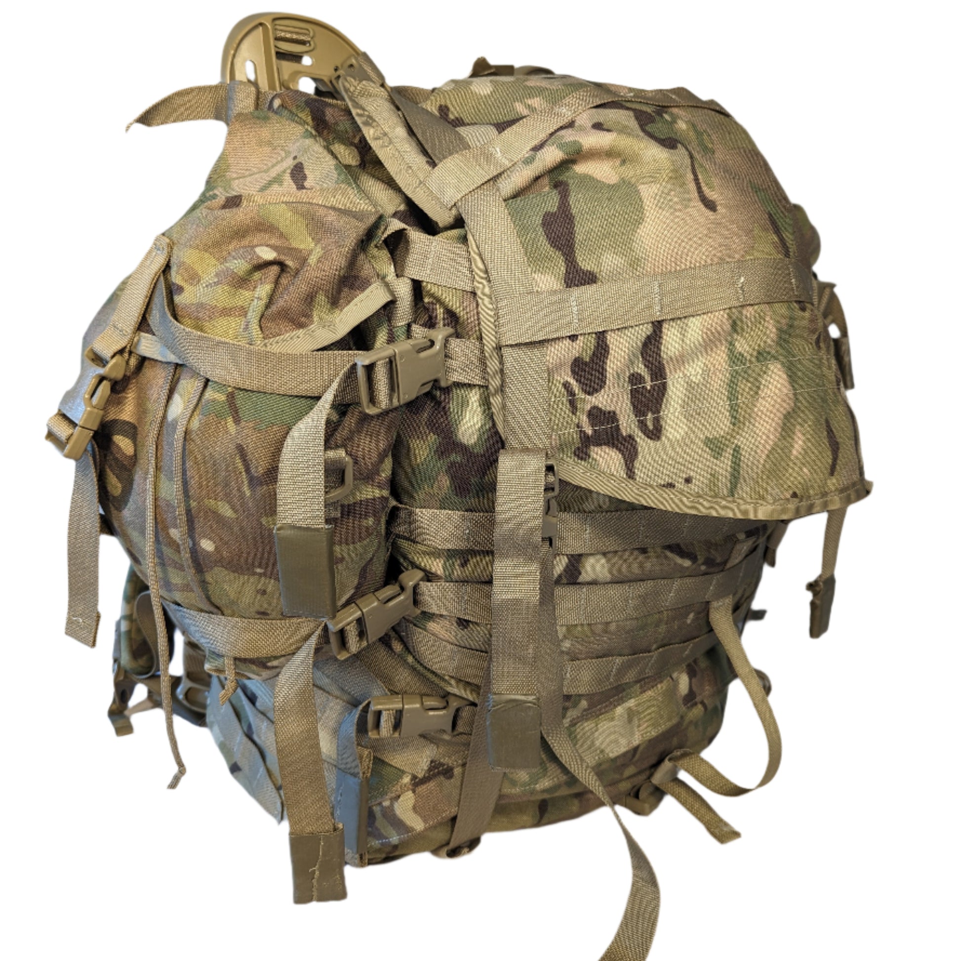 A large U.S. Military Surplus Large Field Pack in OCP/Multicam camouflage, heavily compressed and standing upright, featuring numerous horizontal MOLLE webbing rows and vertical compression straps.