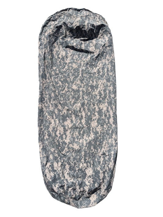 A full-length U.S. Military Surplus Modular Sleep System Bivy Cover in ACU digital camouflage, zipped closed and laid vertically on a clean white background, displaying its mummy bag shape.